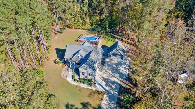view of a house with a yard and sitting area