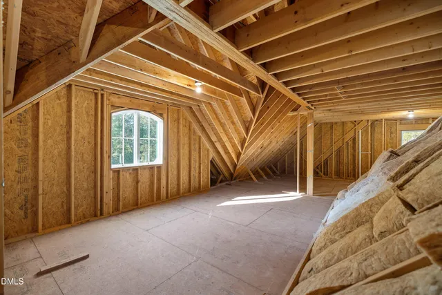 a view of a room with wooden walls
