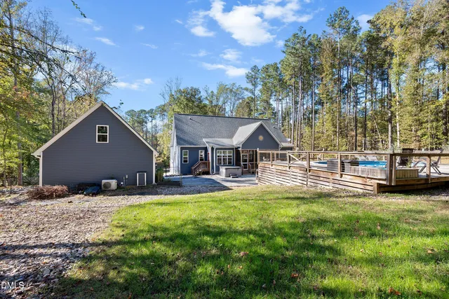 a house view with a sitting space and garden