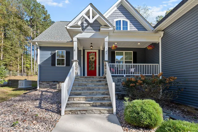 a front view of a house with garage