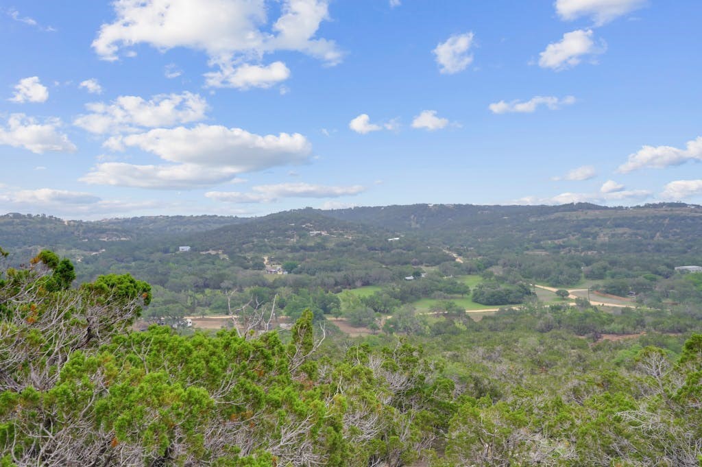 107 Sumac Ridge, Unit 159 Kendalia, TX 78027 - Photo 12 of 30 a view of a big yard with lots of green space