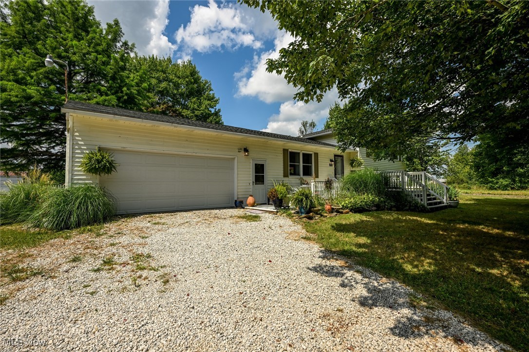 2757 Porter Road Atwater, OH 44201 - Photo 3 of 49 Single story home with an attached garage and gravel driveway