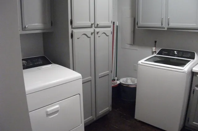 a utility room with dryer and washer