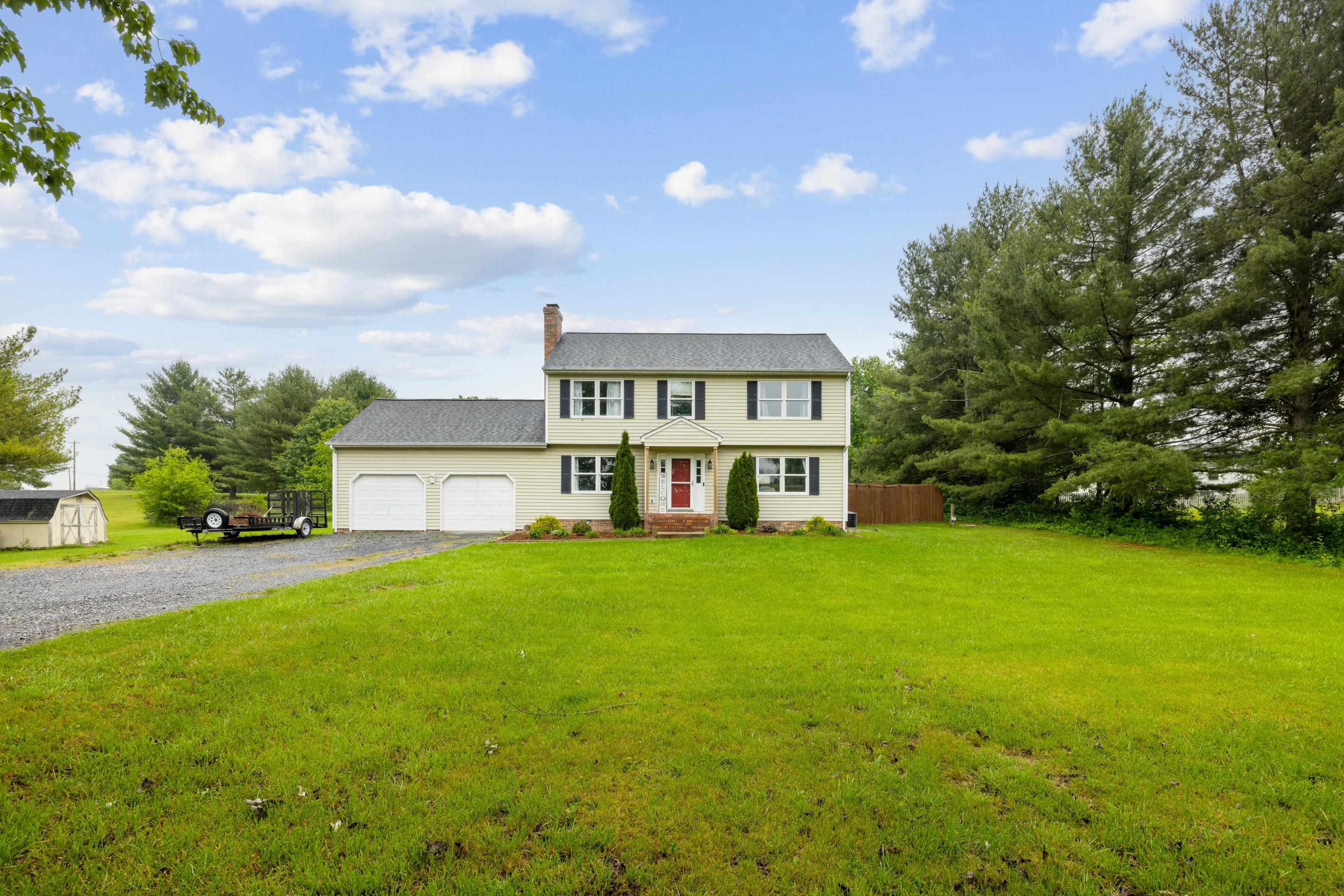 a view of a house with a big yard