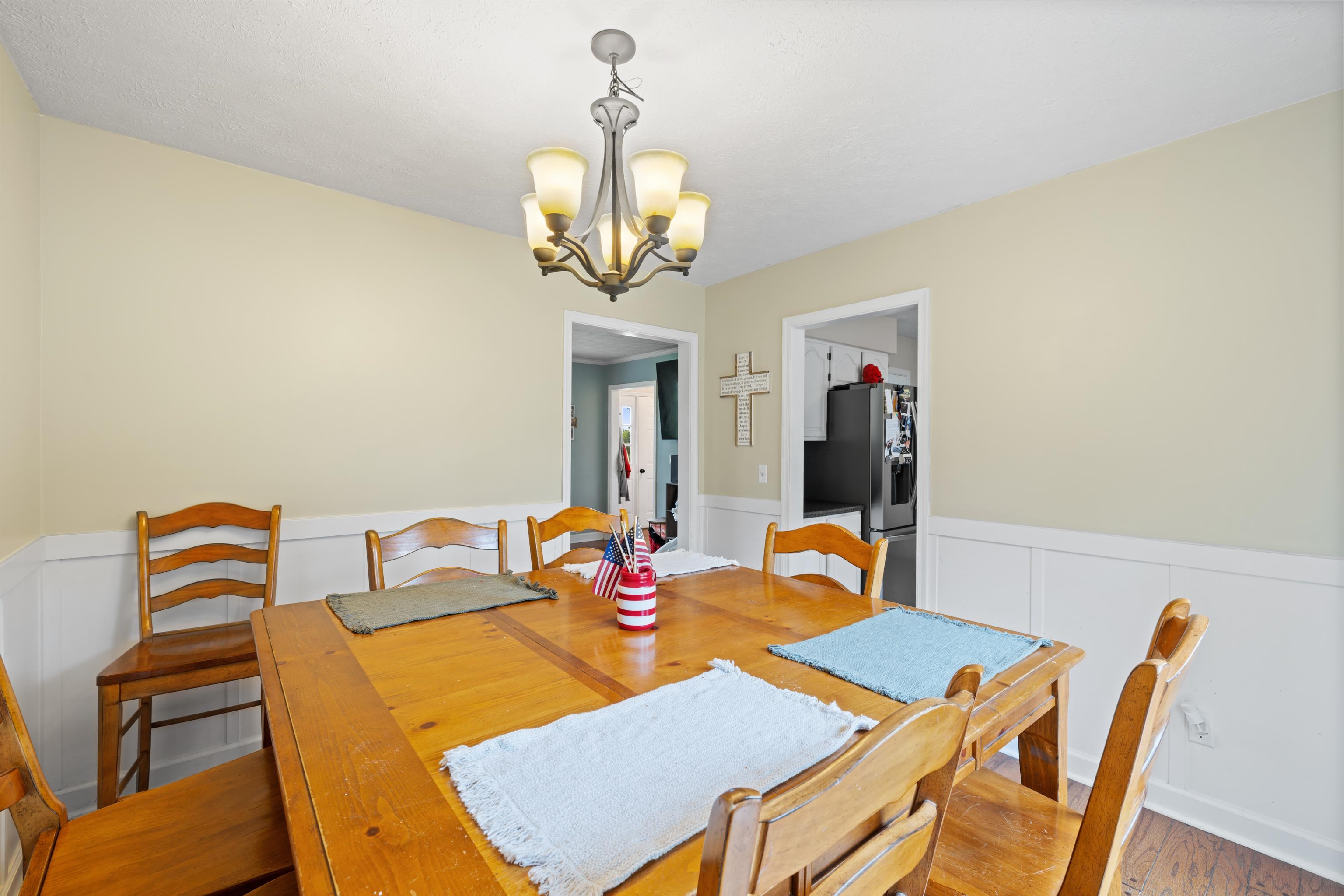 701 Horseshoe Circle Stuarts Draft, VA 24477 - Photo 19 of 70 a view of a dining room with furniture and chandelier