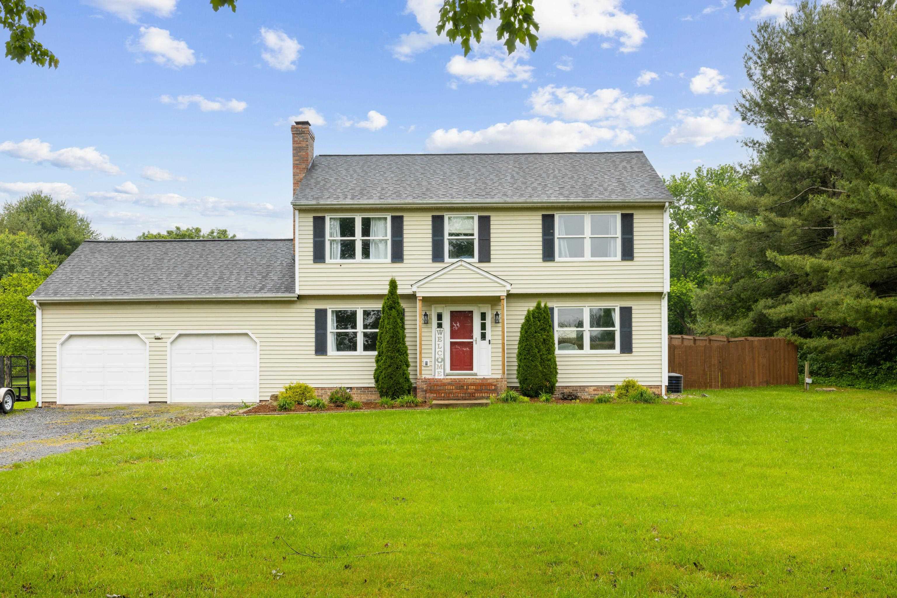 701 Horseshoe Circle Stuarts Draft, VA 24477 - Photo 2 of 70 a front view of a house with a garden and yard
