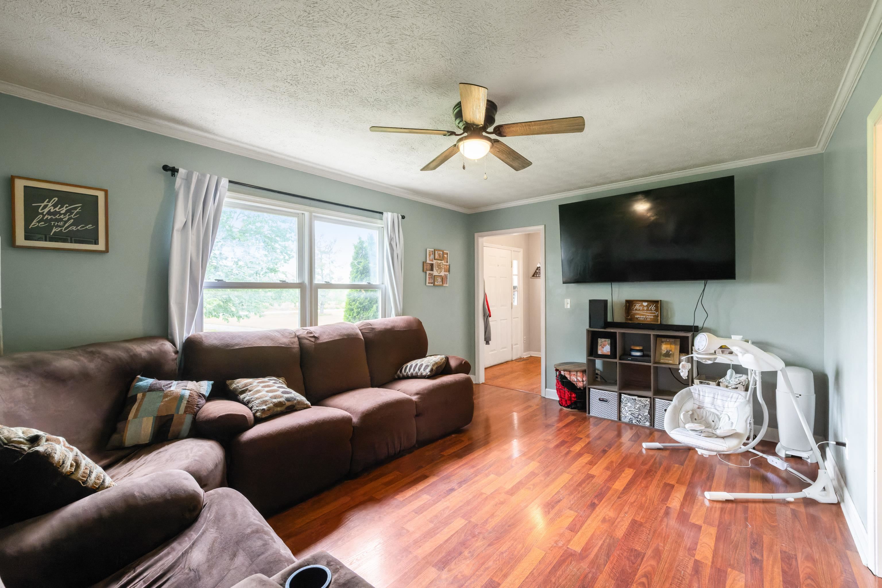 701 Horseshoe Circle Stuarts Draft, VA 24477 - Photo 22 of 70 a living room with furniture and a flat screen tv