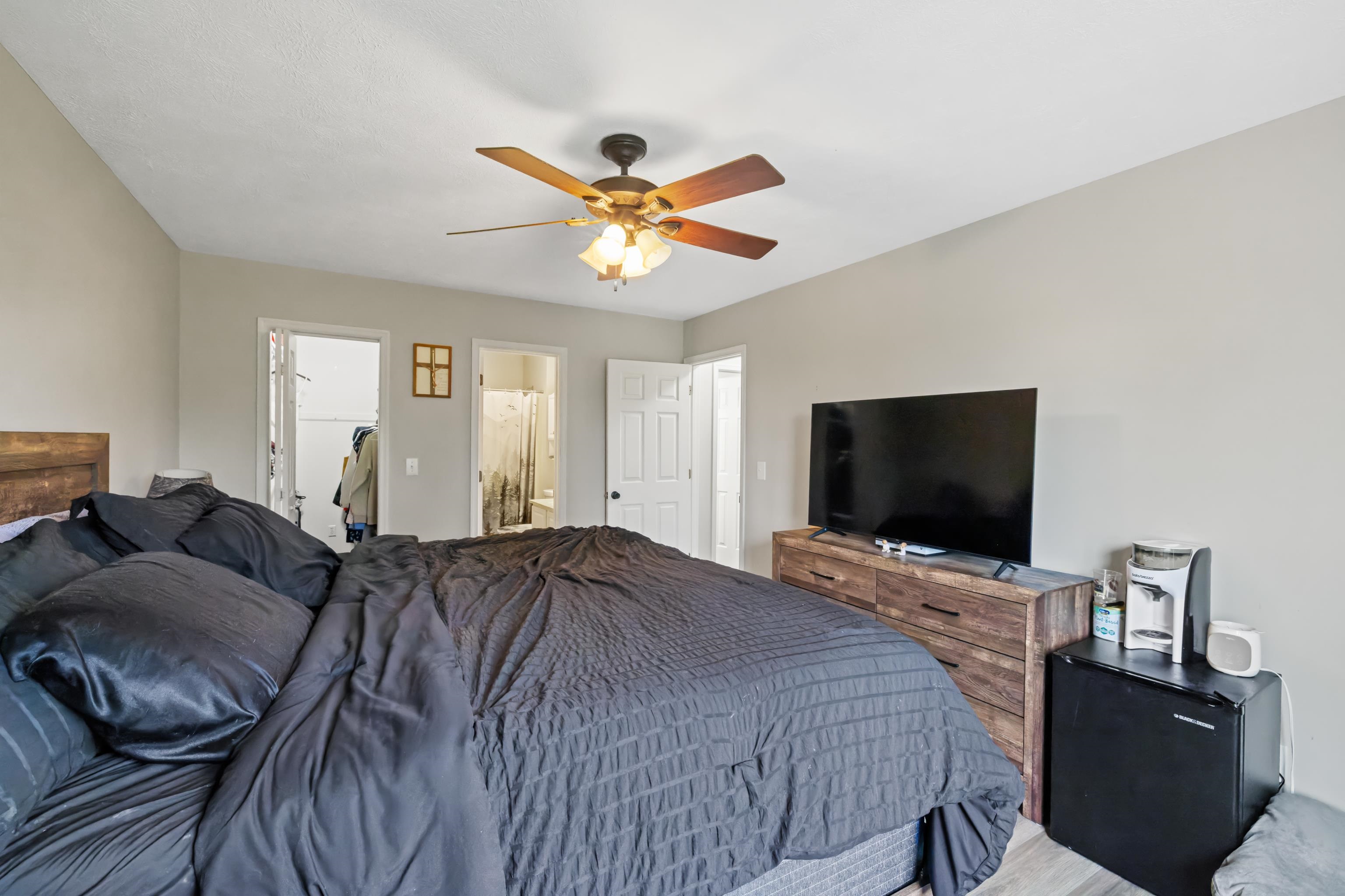 701 Horseshoe Circle Stuarts Draft, VA 24477 - Photo 24 of 70 a bedroom with a bed and a flat screen tv