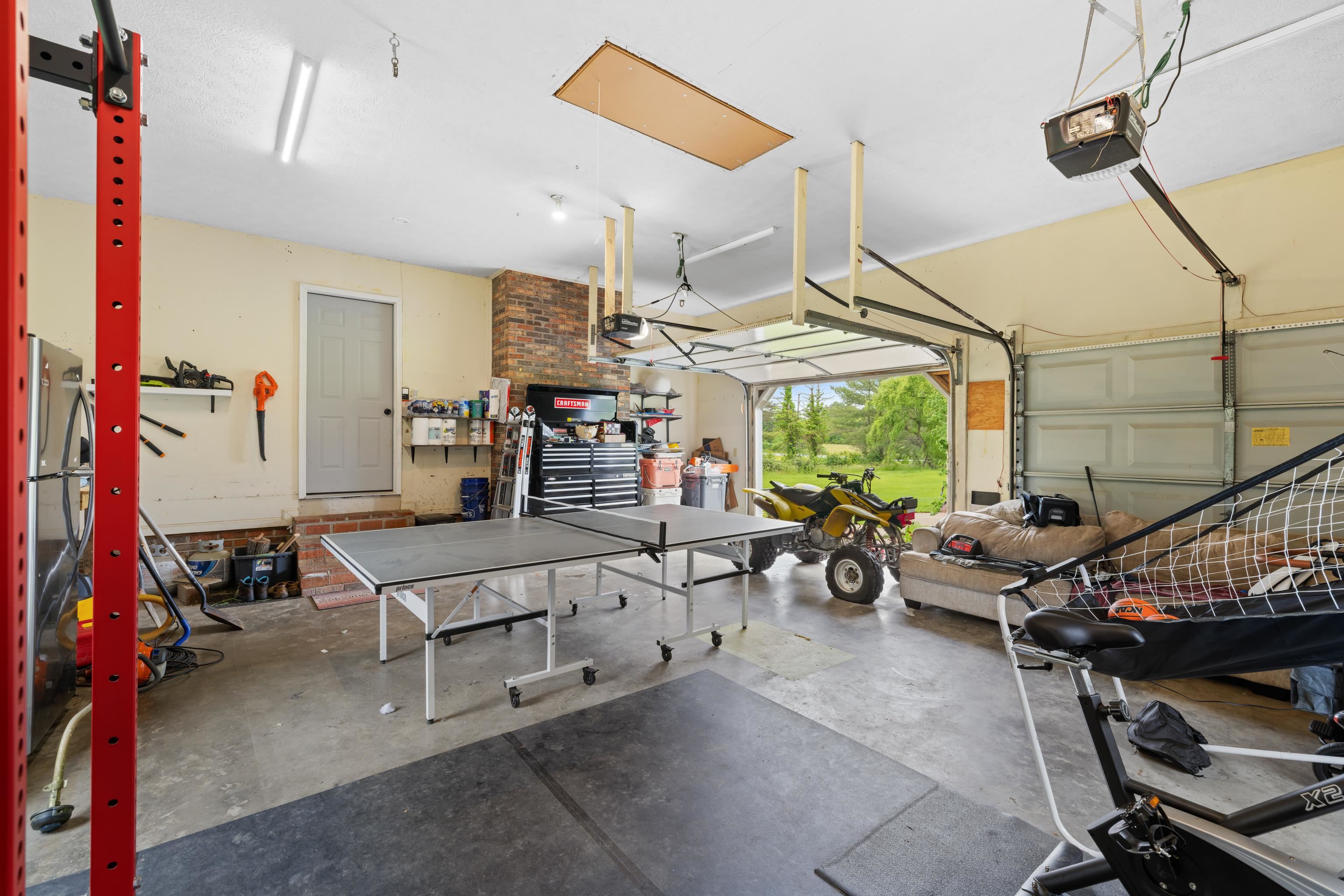 701 Horseshoe Circle Stuarts Draft, VA 24477 - Photo 43 of 70 a living room with lots of furniture and a chandelier