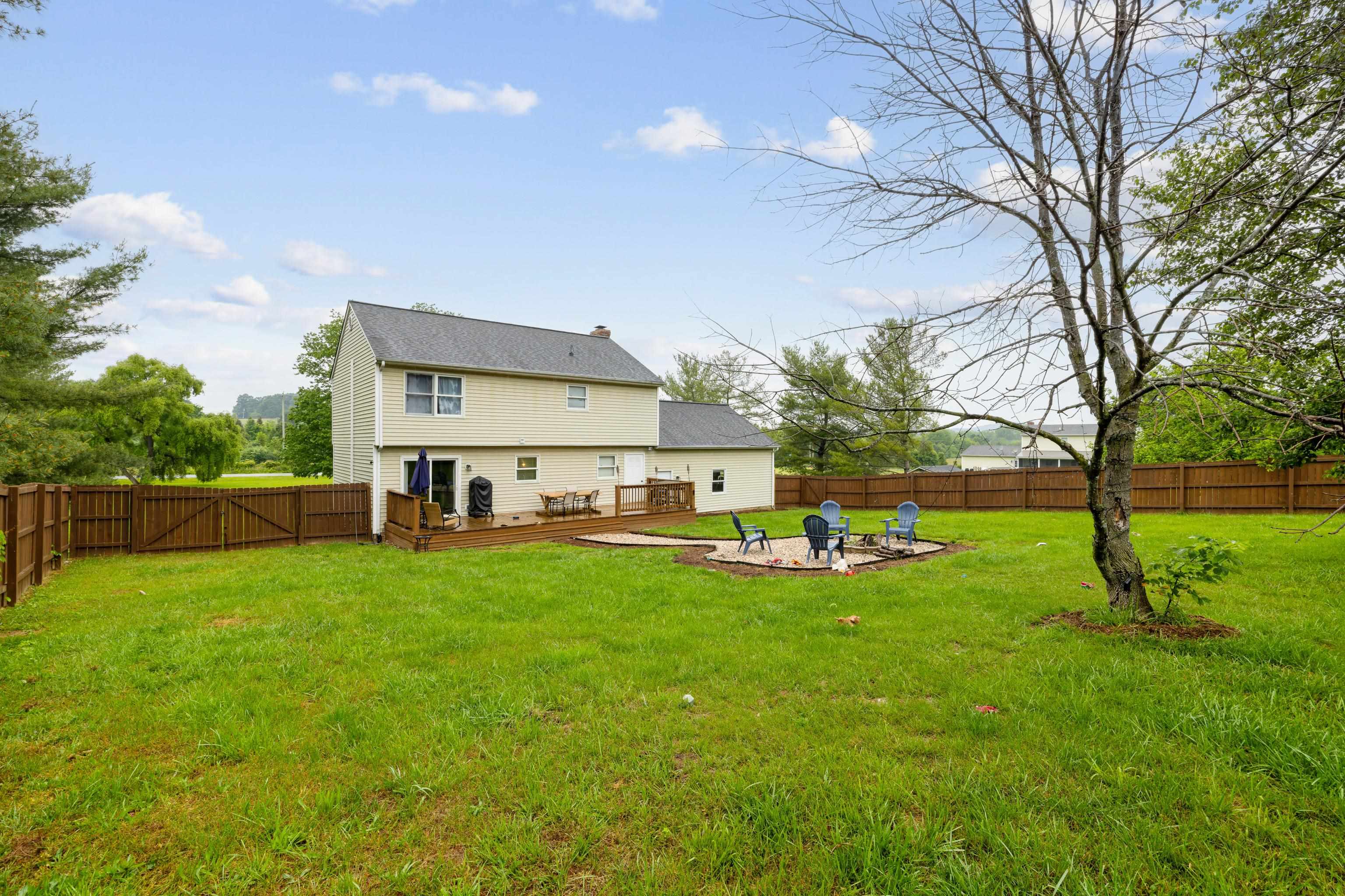 701 Horseshoe Circle Stuarts Draft, VA 24477 - Photo 49 of 70 a view of a house with backyard and a tree