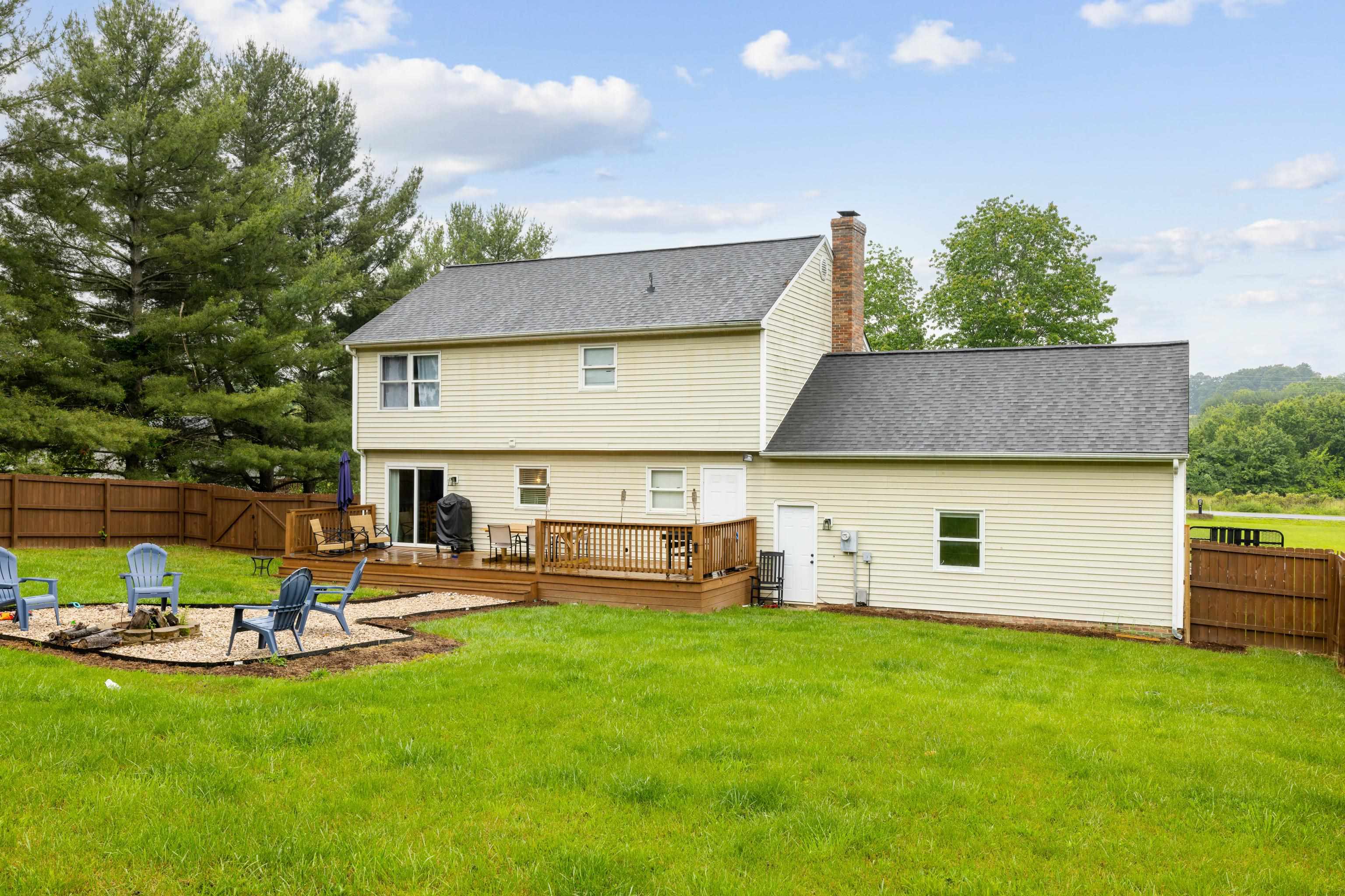 701 Horseshoe Circle Stuarts Draft, VA 24477 - Photo 52 of 70 a view of a house with backyard porch and sitting area