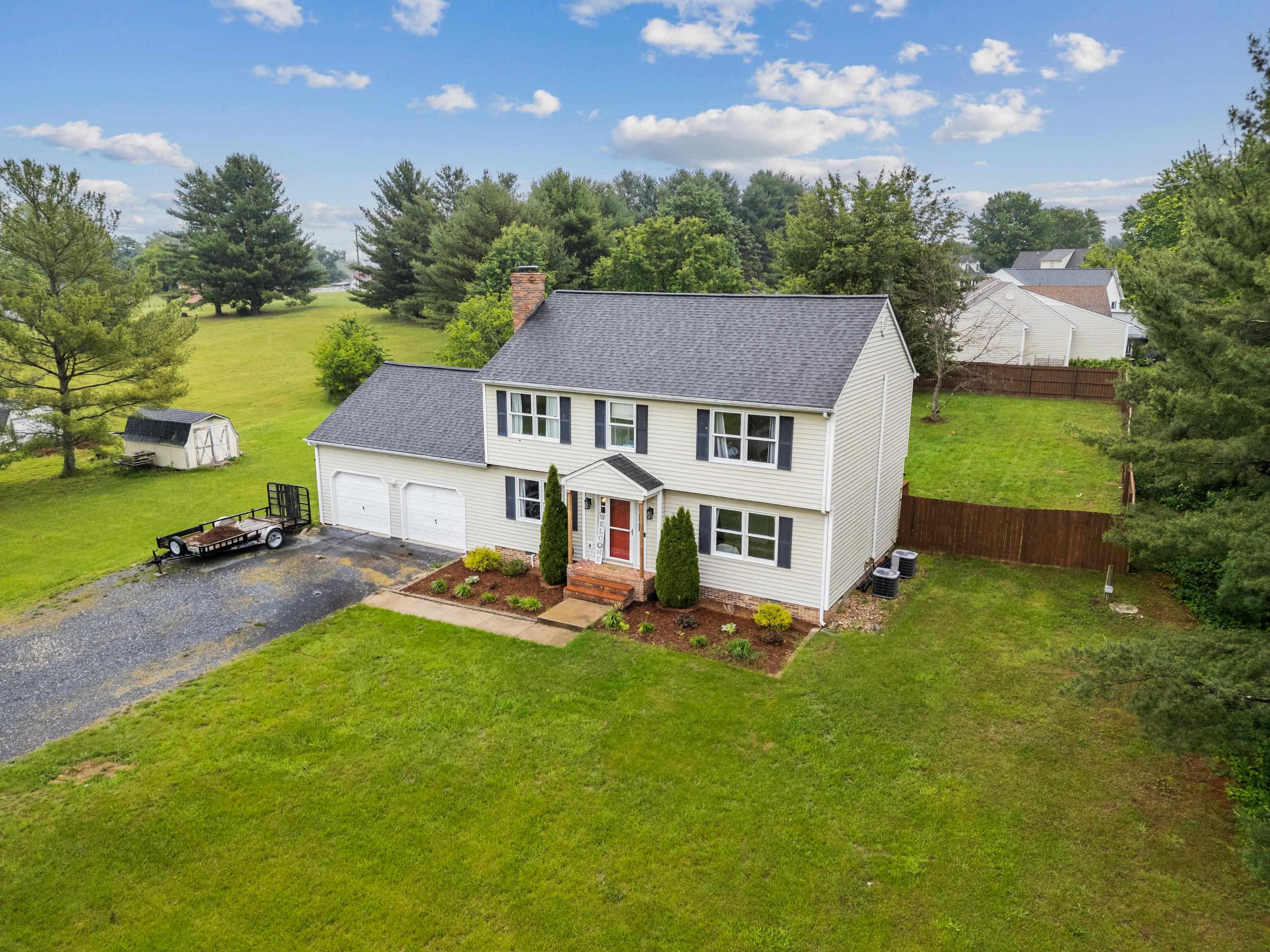 701 Horseshoe Circle Stuarts Draft, VA 24477 - Photo 55 of 70 an aerial view of a house with swimming pool and garden