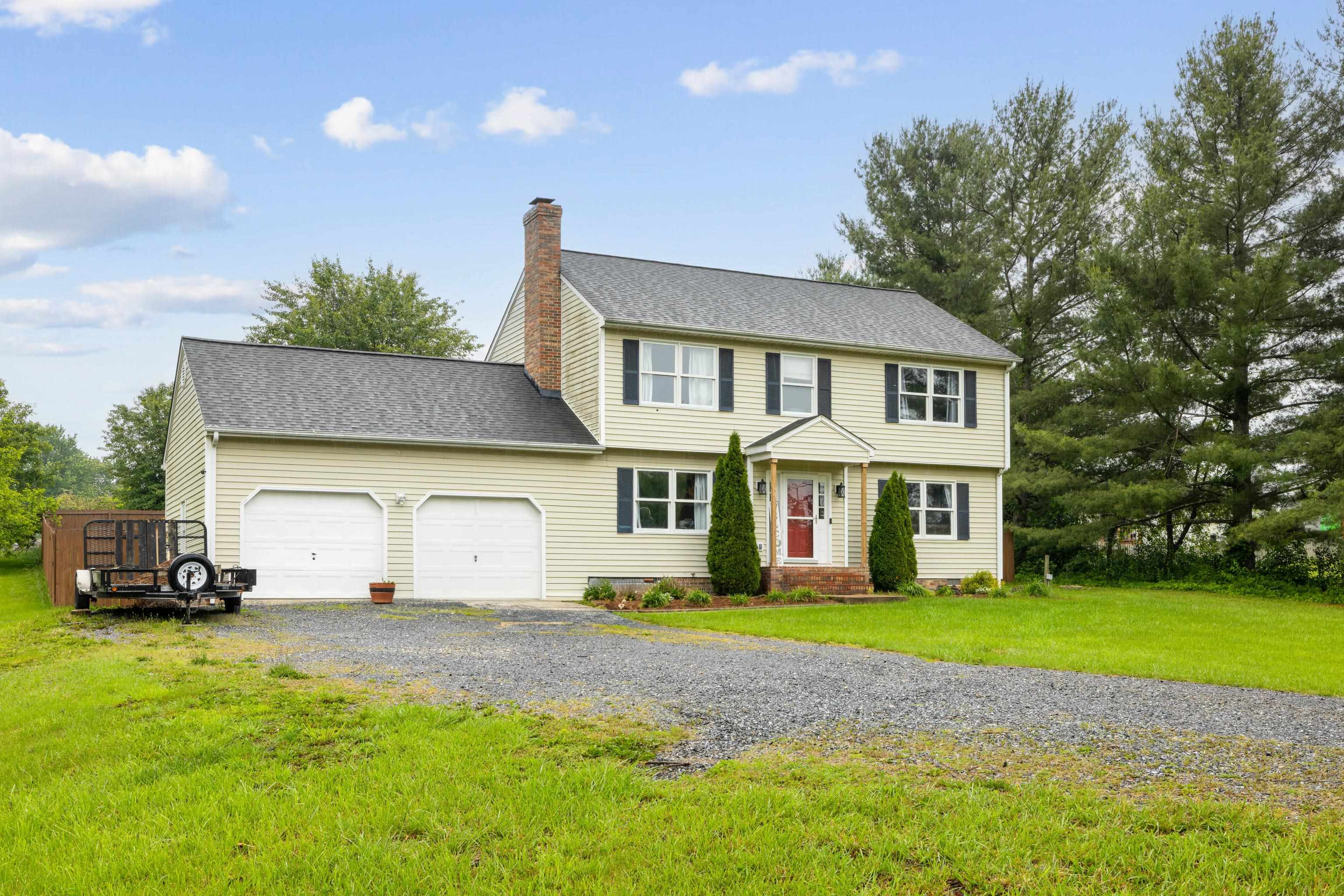 701 Horseshoe Circle Stuarts Draft, VA 24477 - Photo 68 of 70 a front view of a house with a garden