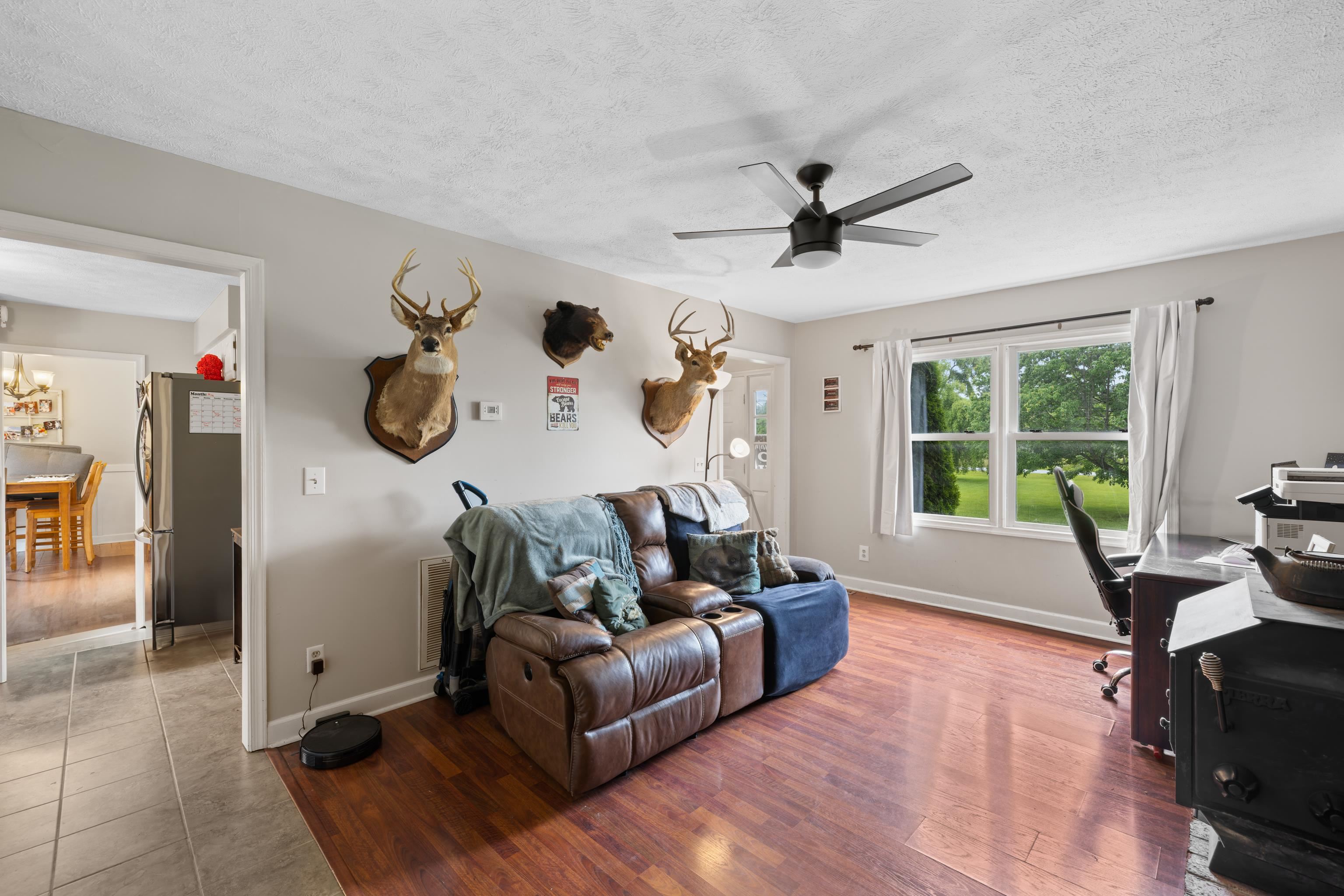 701 Horseshoe Circle Stuarts Draft, VA 24477 - Photo 7 of 70 a living room with furniture and a large window