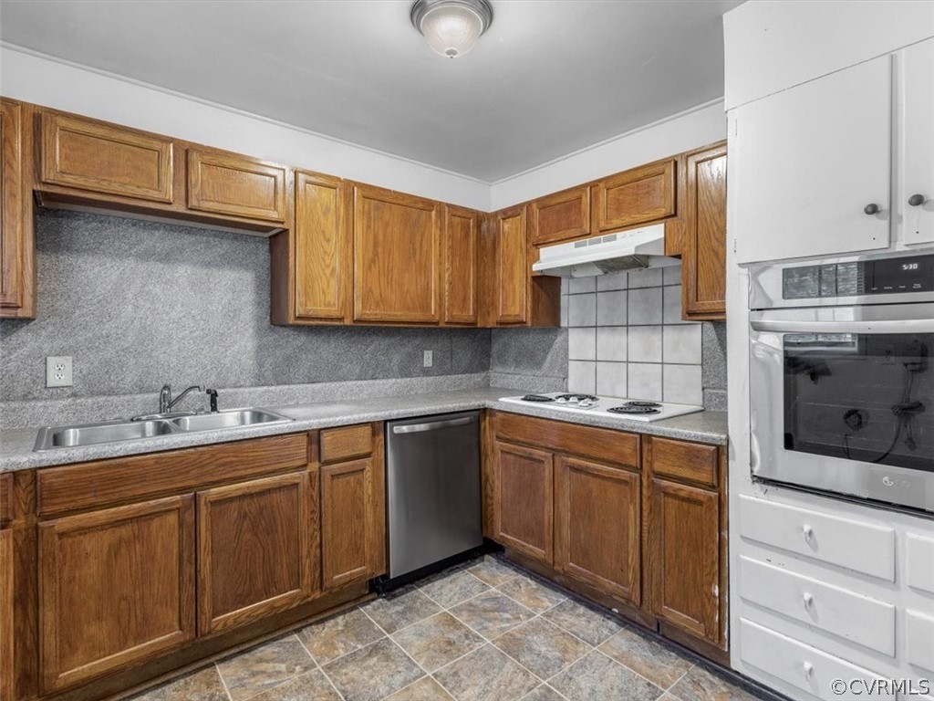1314 Andover Road Henrico, VA 23229 - Photo 13 of 24 a kitchen with sink cabinets and microwave