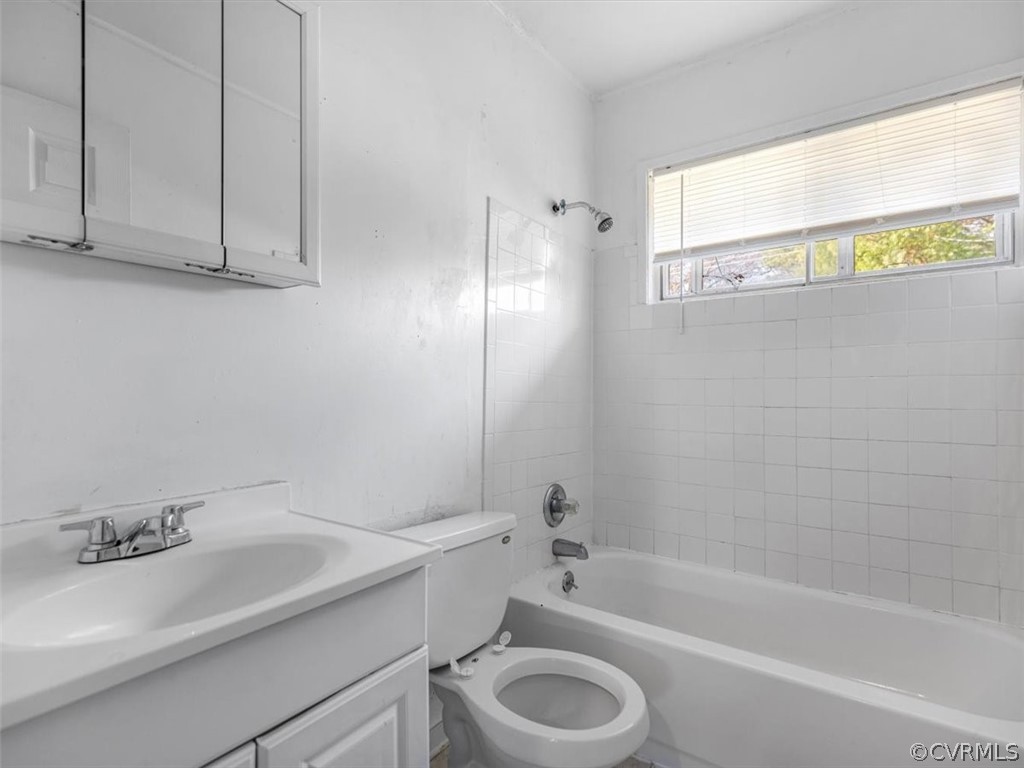 1314 Andover Road Henrico, VA 23229 - Photo 19 of 24 a bathroom with a sink a toilet and bathtub