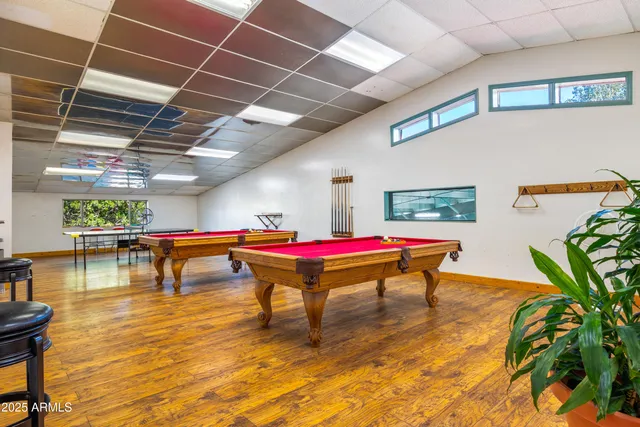 a room with table tennis pool table and couches