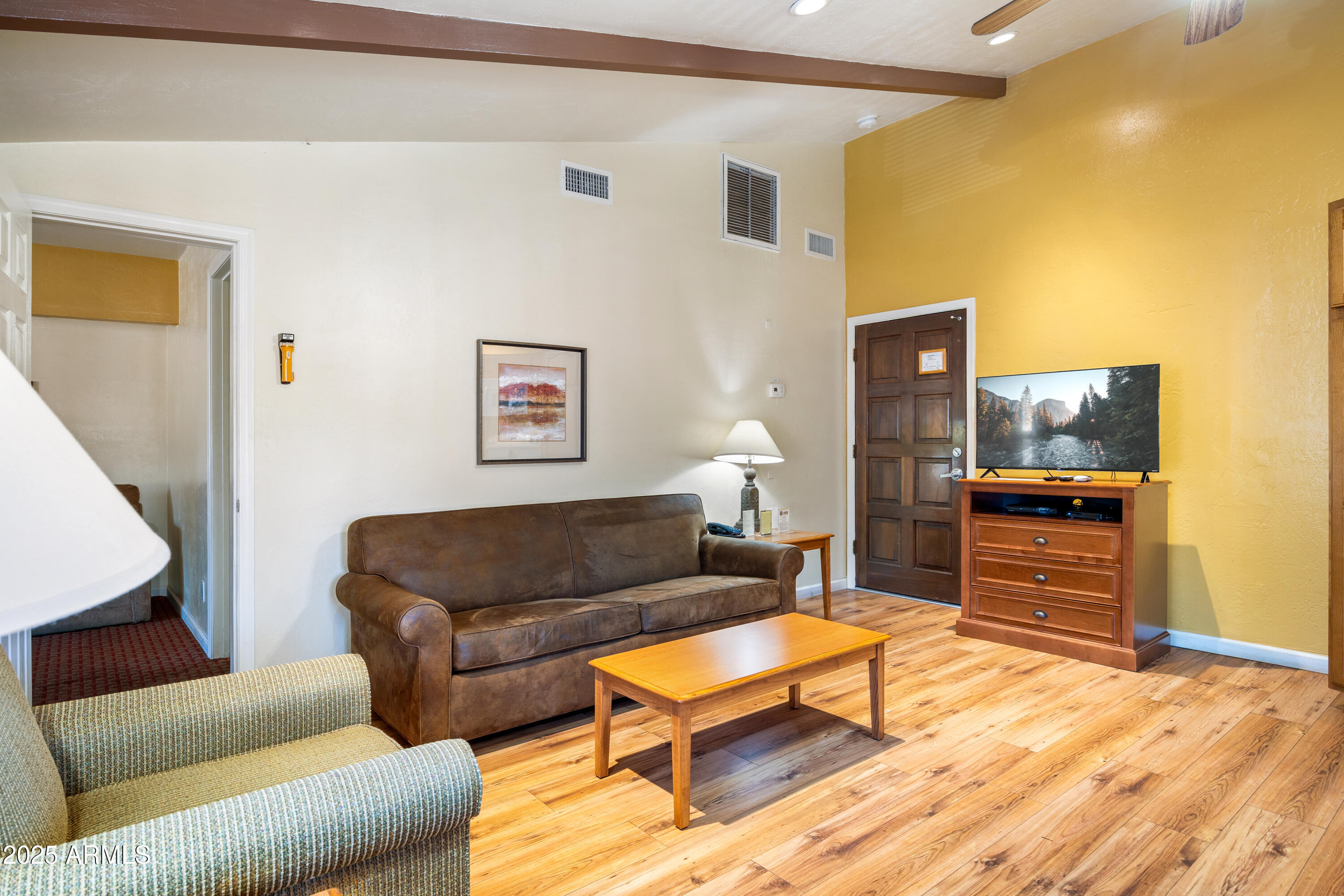 5829 East Buck Springs Road, Unit 200 Pinetop, AZ 85935 - Photo 9 of 18 a living room with furniture and a flat screen tv