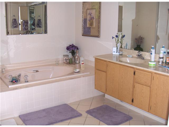 367 River Edge Road Jupiter, FL 33477 - Photo 7 of 17 a bathroom with a tub sink and mirror