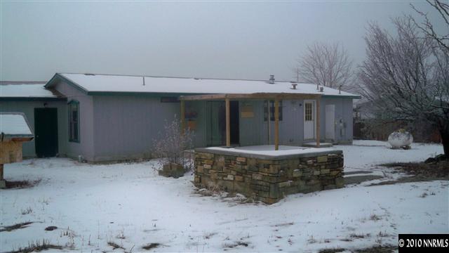 17225 Waxwing Street Reno, NV 89508 - Photo 11 of 13 a view of a house with a snow in the yard