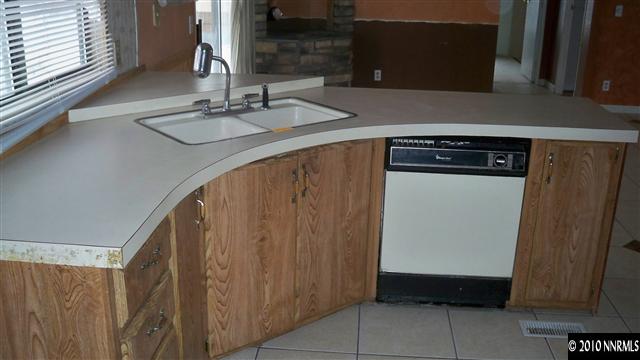 17225 Waxwing Street Reno, NV 89508 - Photo 3 of 13 a bathroom with a sink and a mirror