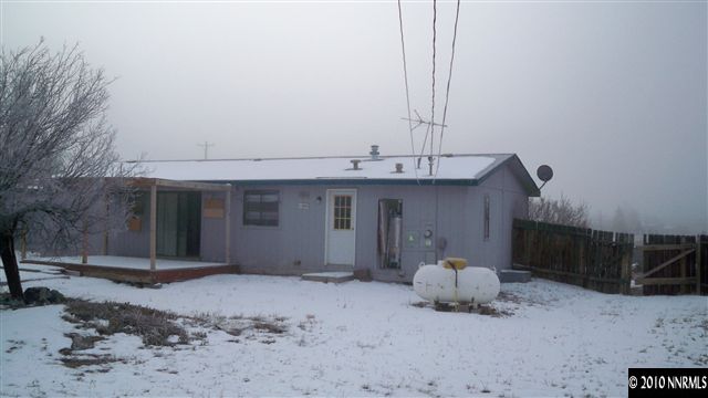 17225 Waxwing Street Reno, NV 89508 - Photo 10 of 13 a front view of a house with a yard