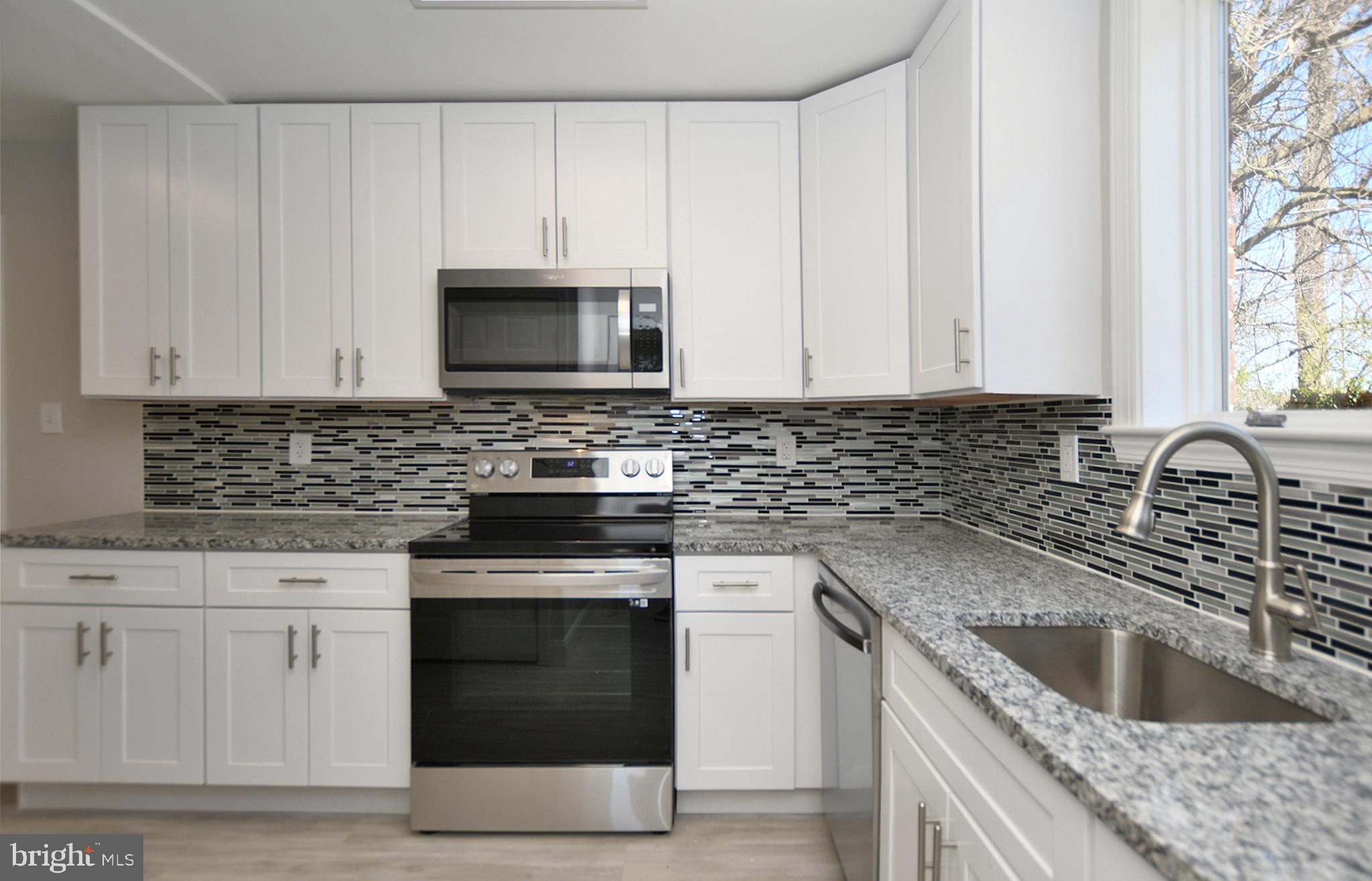 3105 Dawson Avenue Silver Spring, MD 20902 - Photo 10 of 40 Newly renovated kitchen w/ loads of fine features!