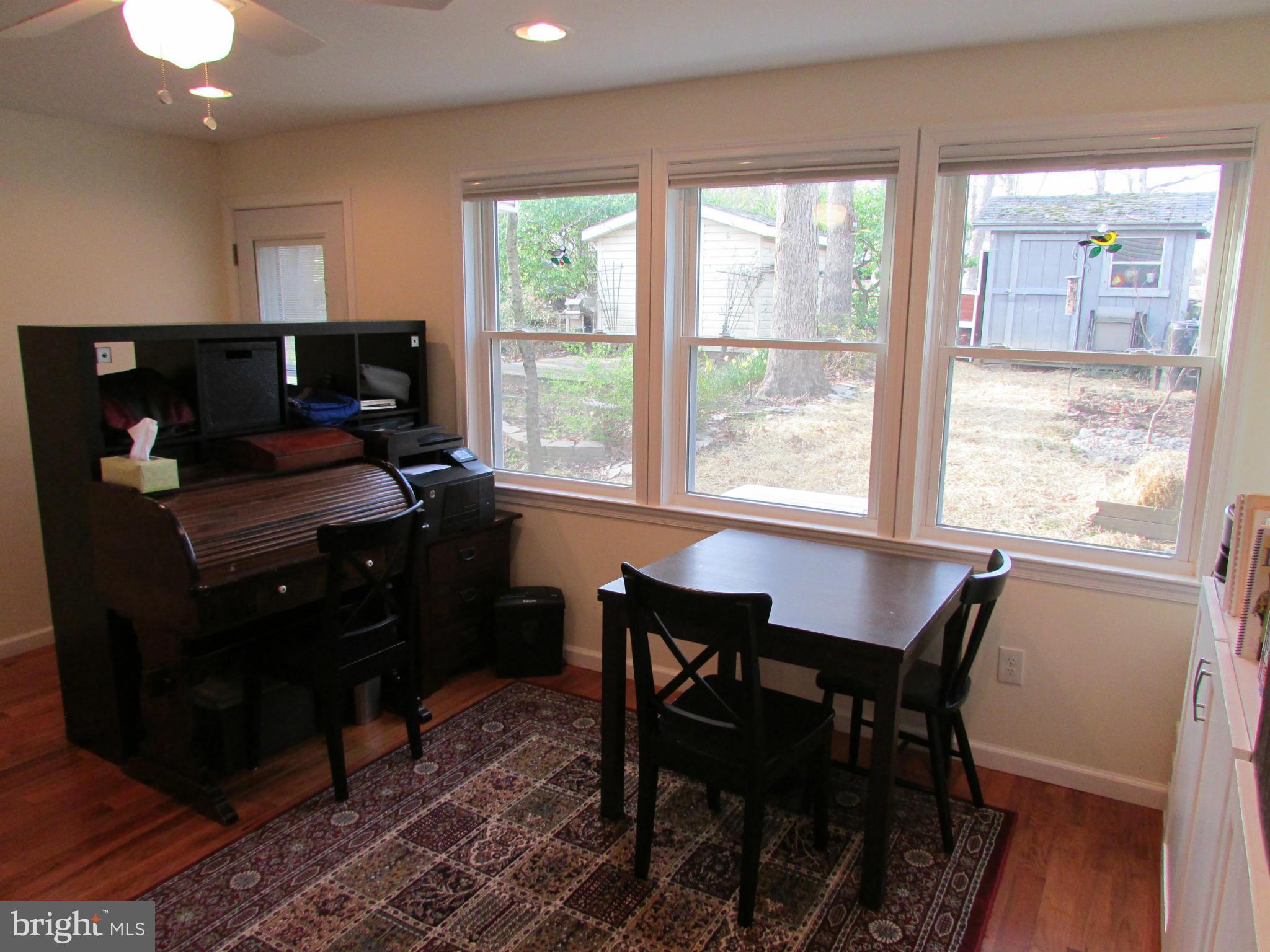 54 Ridge Road, Unit L Greenbelt, MD 20770 - Photo 8 of 18 a dining room with furniture and a window