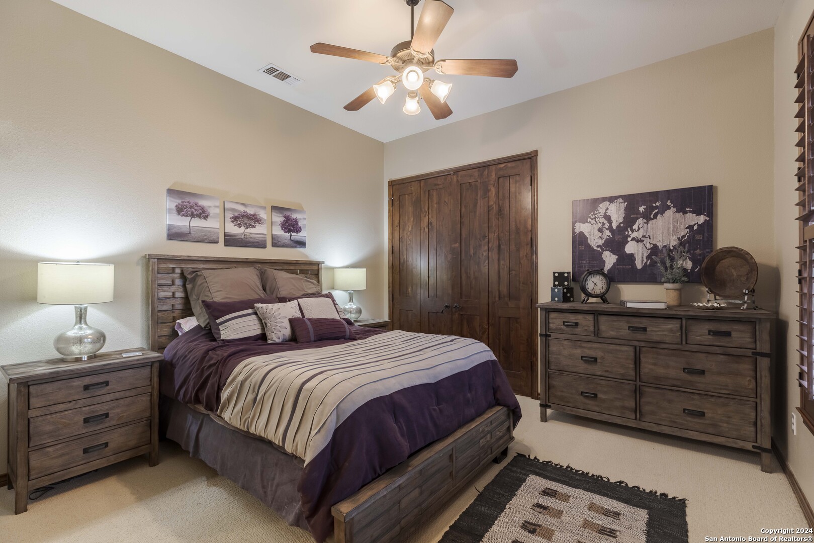 3801-15 Club House Road, Unit 15 Kerrville, TX 78028 - Photo 15 of 26 a bedroom with a bed and a chandelier