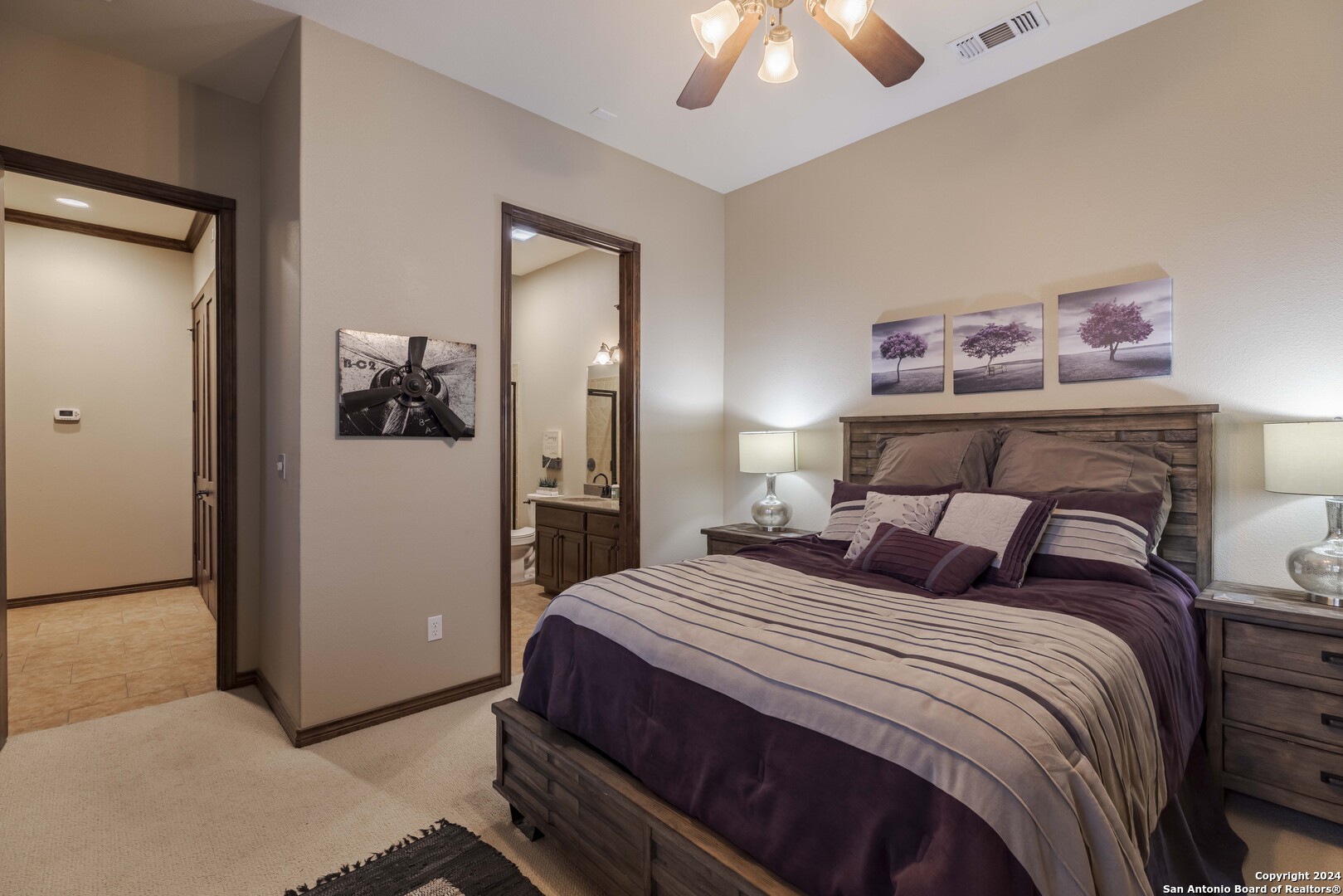 3801-15 Club House Road, Unit 15 Kerrville, TX 78028 - Photo 16 of 26 a bedroom with a bed and a chandelier