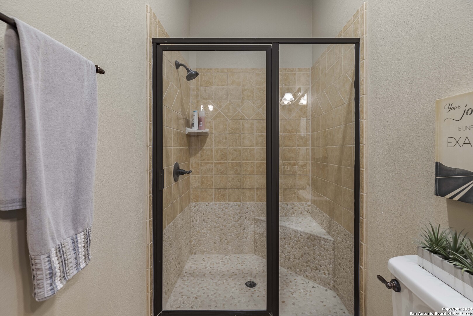 3801-15 Club House Road, Unit 15 Kerrville, TX 78028 - Photo 18 of 26 a bathroom with a glass shower door