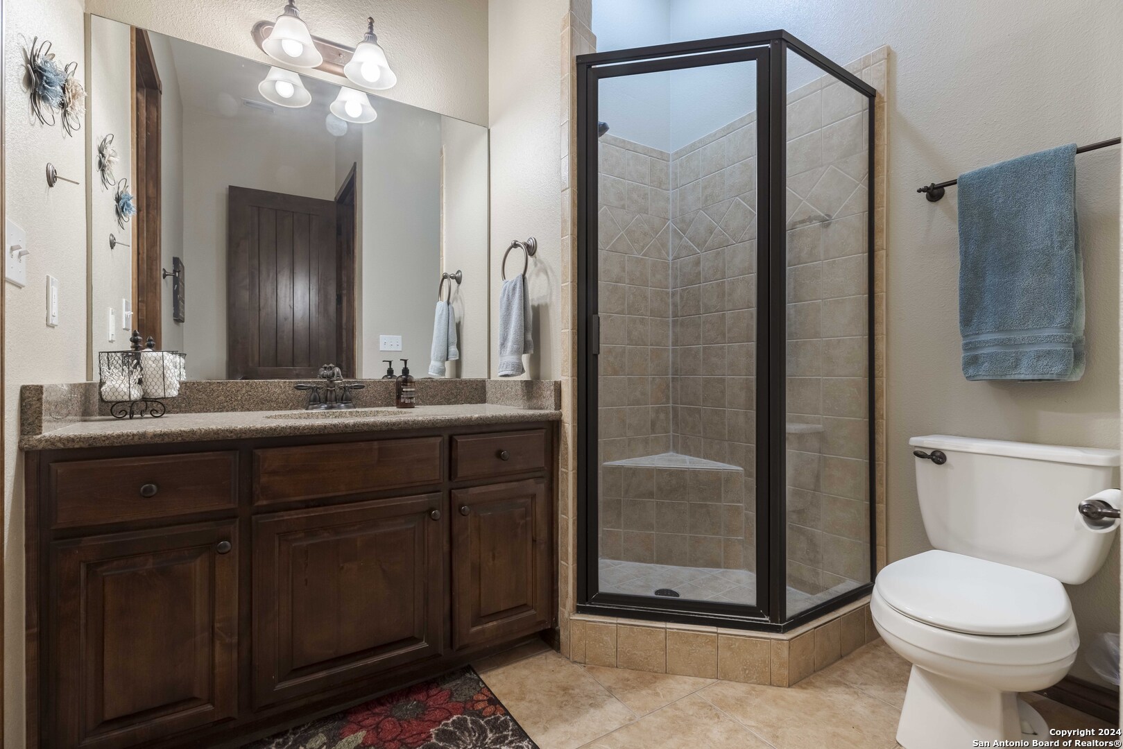 3801-15 Club House Road, Unit 15 Kerrville, TX 78028 - Photo 20 of 26 a bathroom with a sink a toilet and shower
