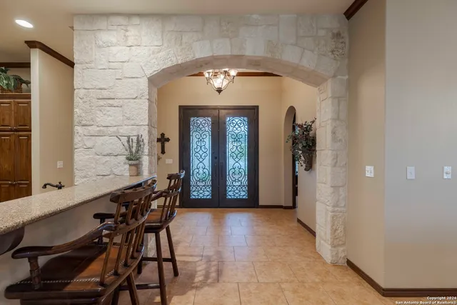 a view of a hallway with seating area
