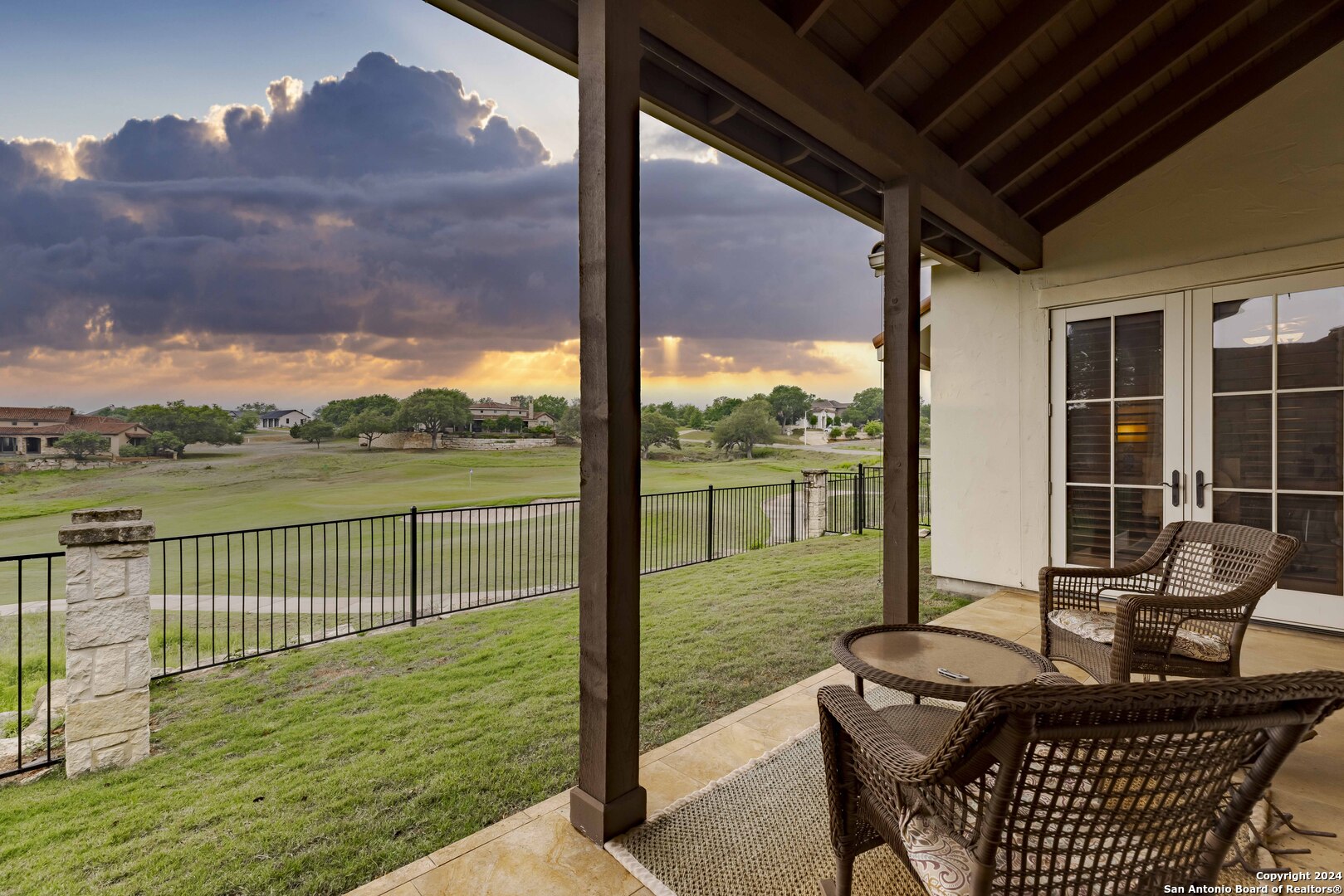 3801-15 Club House Road, Unit 15 Kerrville, TX 78028 - Photo 23 of 26 a view of balcony with couch and wooden floor