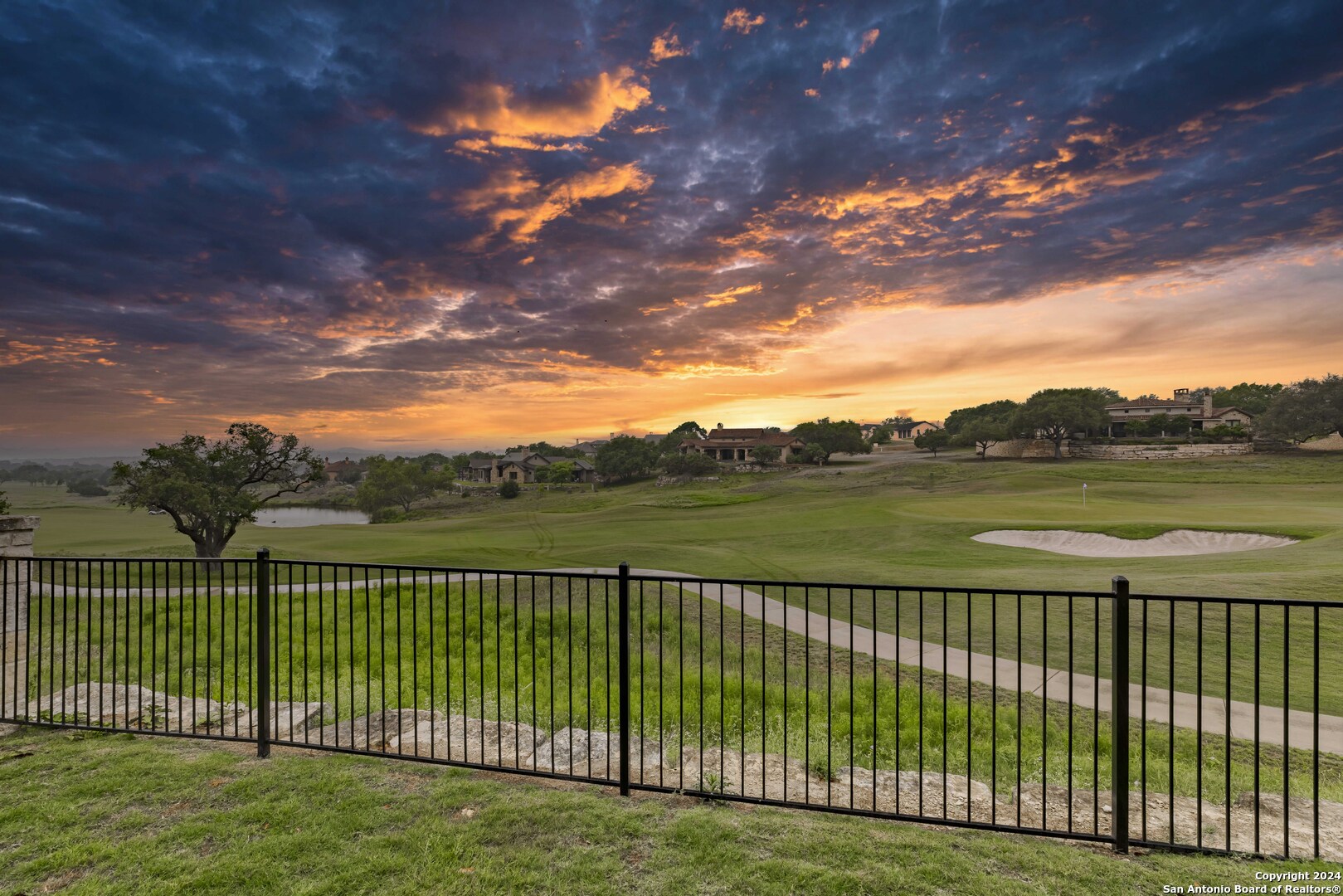 3801-15 Club House Road, Unit 15 Kerrville, TX 78028 - Photo 25 of 26 a view of a lake with a garden