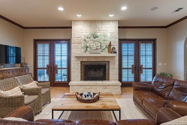 a living room with furniture and a fireplace