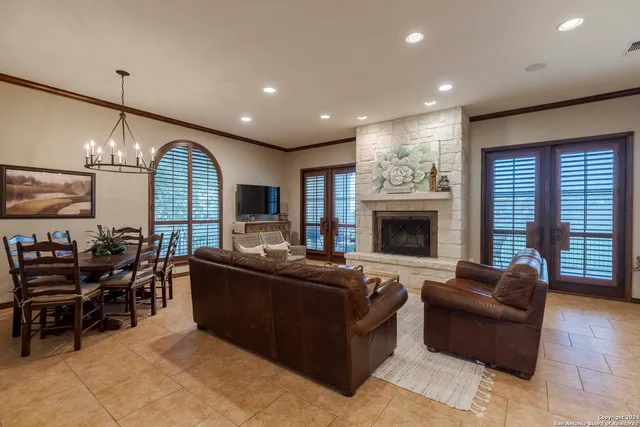 a living room with furniture fireplace and flat screen tv