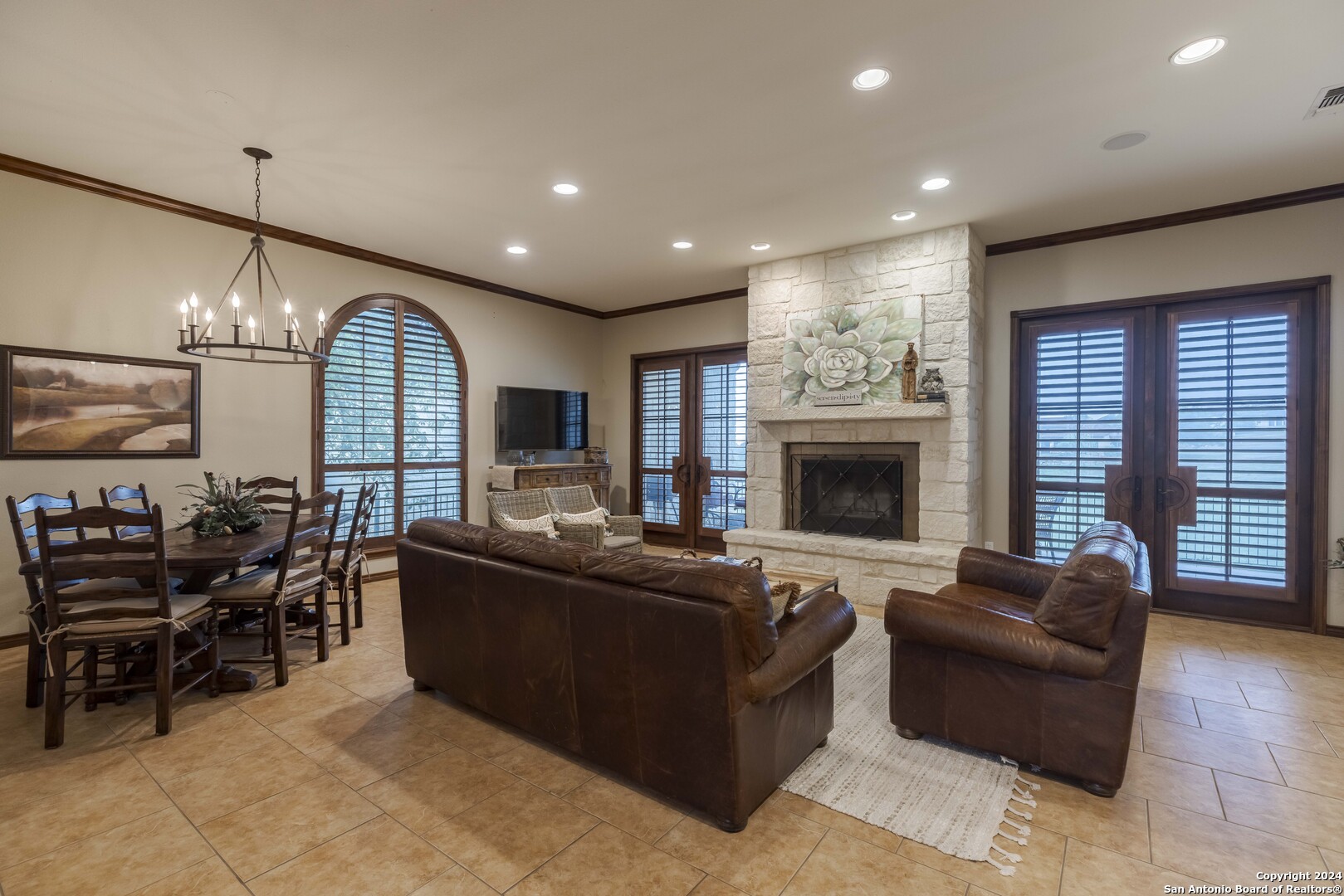 3801-15 Club House Road, Unit 15 Kerrville, TX 78028 - Photo 4 of 26 a living room with furniture fireplace and flat screen tv