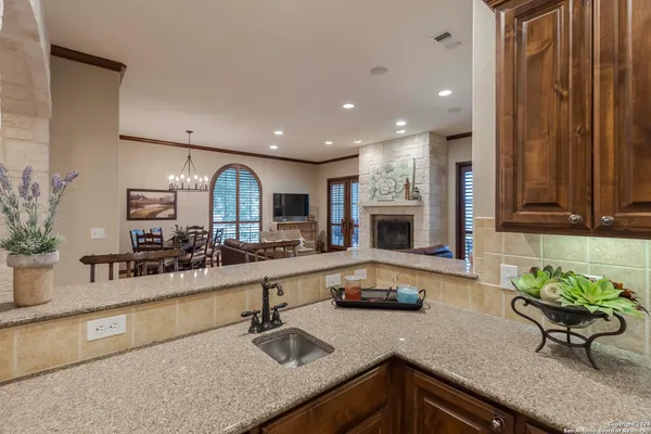a kitchen with counter top space a sink and cabinets