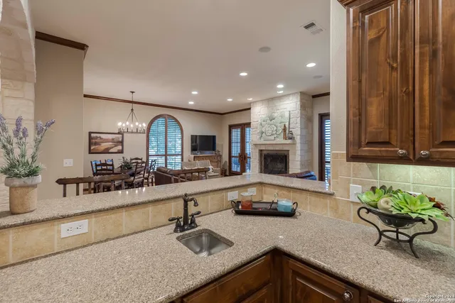 a kitchen with counter top space a sink and cabinets
