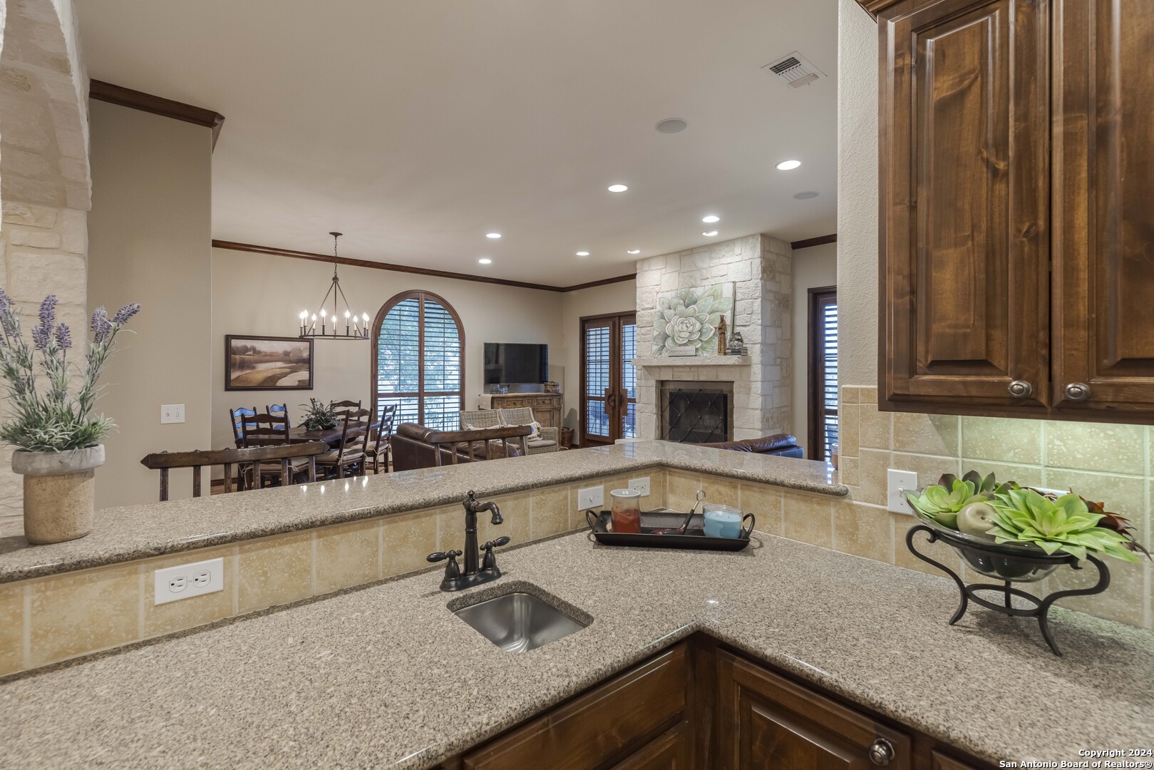 3801-15 Club House Road, Unit 15 Kerrville, TX 78028 - Photo 7 of 26 a kitchen with counter top space a sink and cabinets