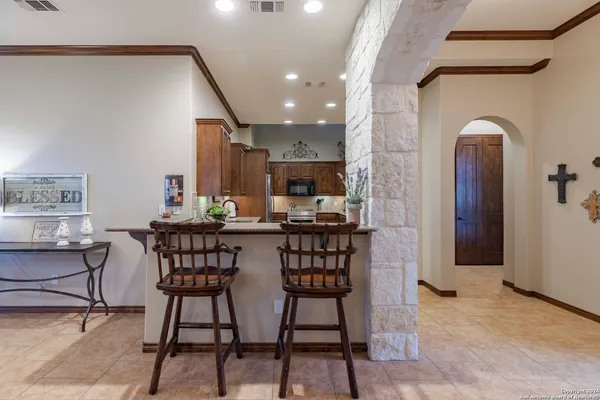 a dining room with furniture and window