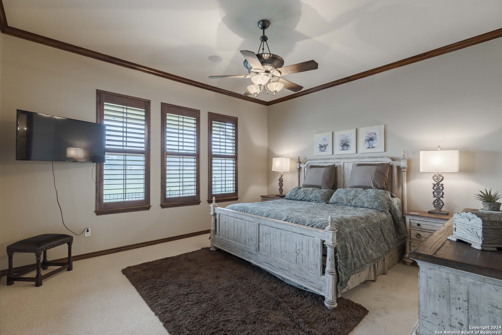 3801-15 Club House Road, Unit 15 Kerrville, TX 78028 - Photo 10 of 26 a bedroom with a bed chandelier and a window