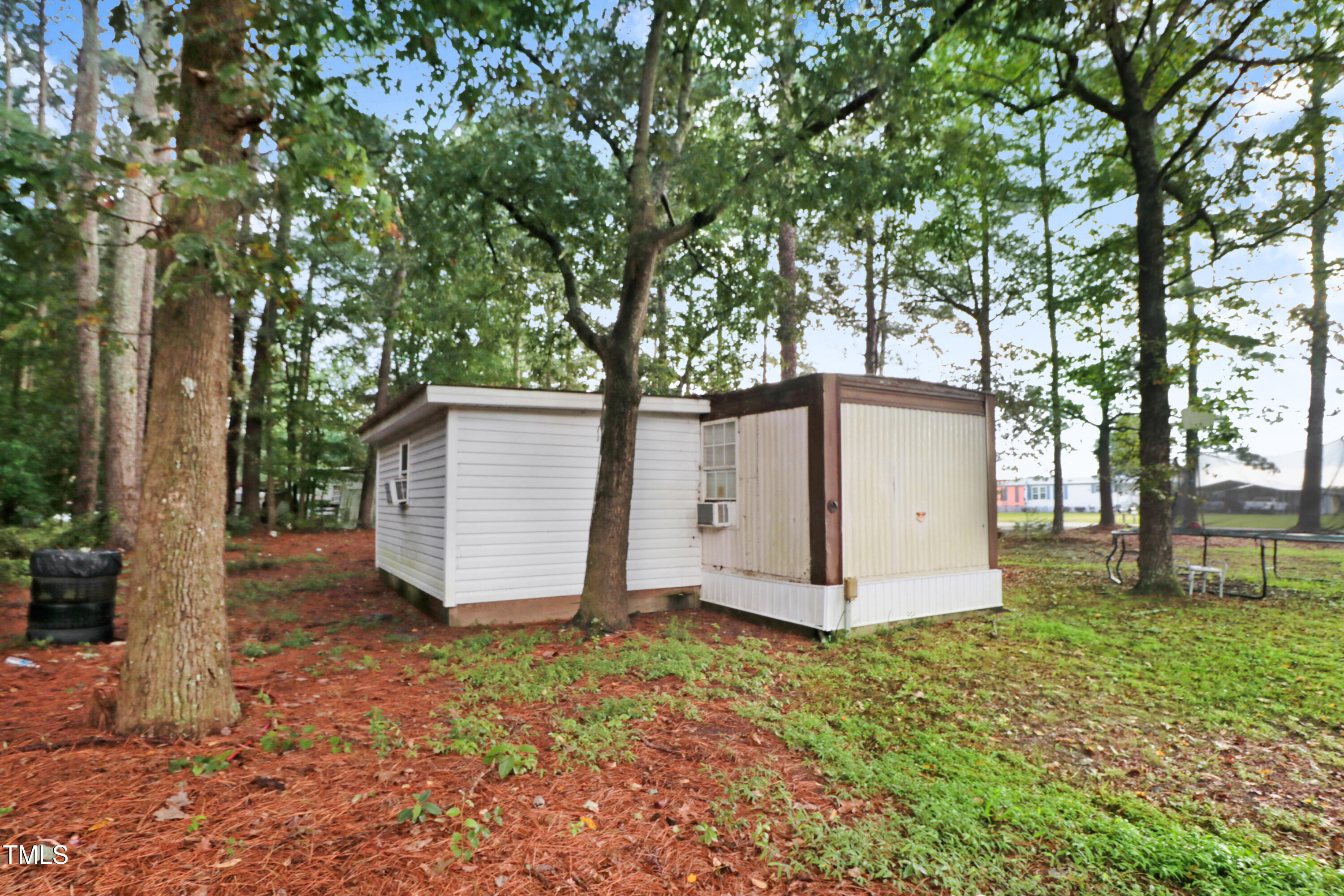 2037 Old Rock Quarry Road Princeton, NC 27569 - Photo 11 of 25 a view of a small space in front of a house with large trees
