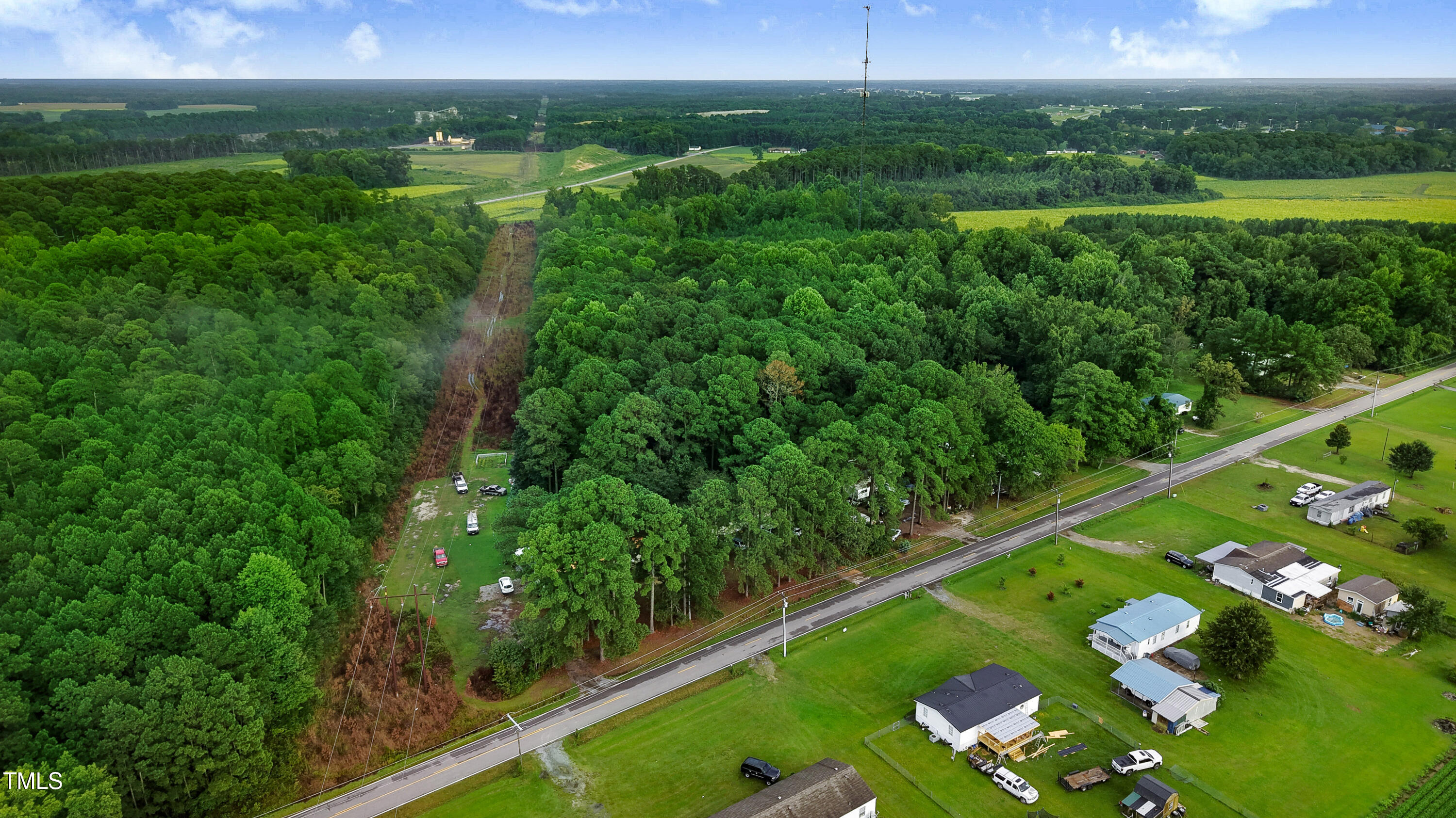 2037 Old Rock Quarry Road Princeton, NC 27569 - Photo 20 of 25 a view of a city with lush green forest