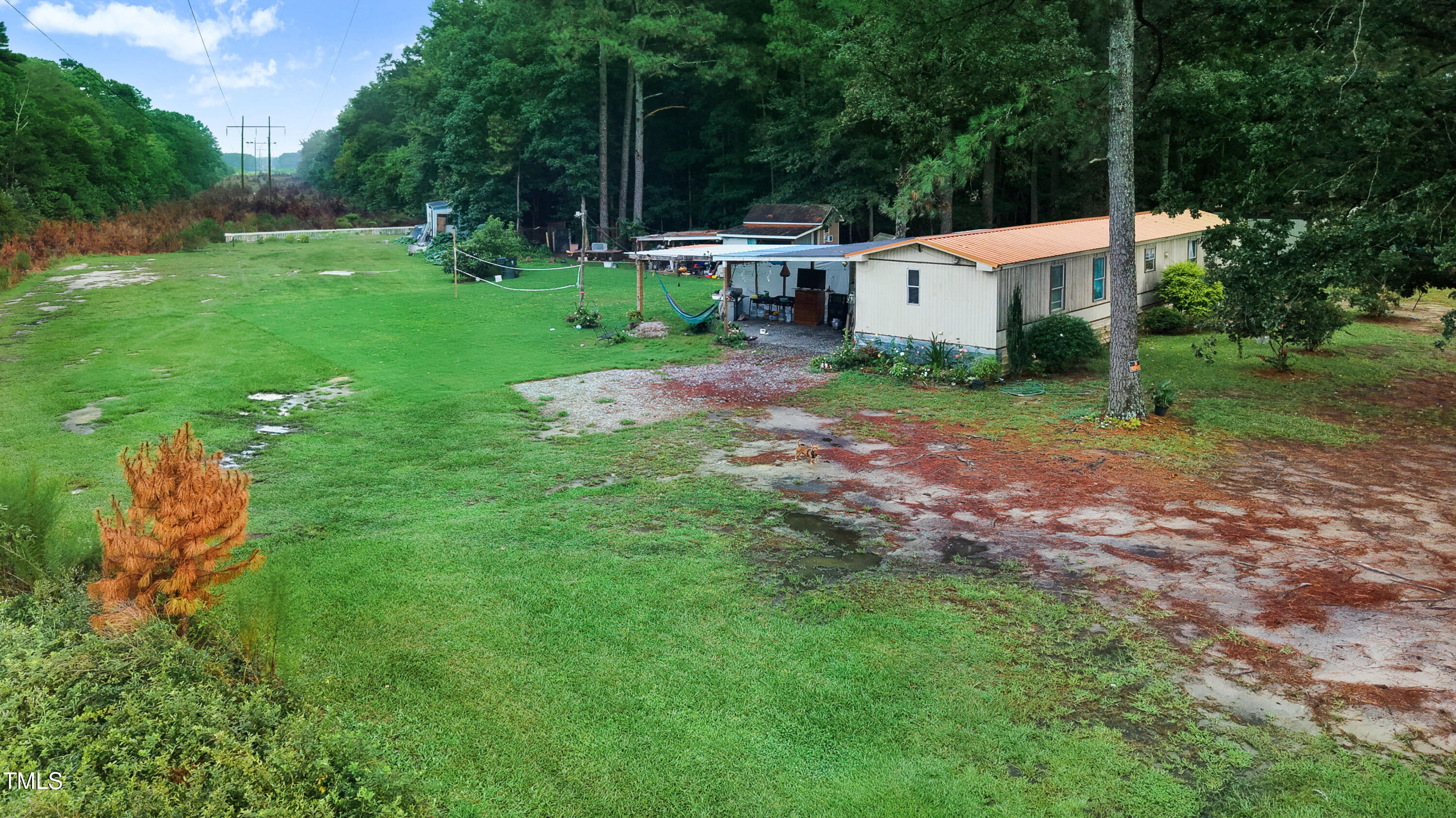 2037 Old Rock Quarry Road Princeton, NC 27569 - Photo 23 of 25 a view of a backyard with a house