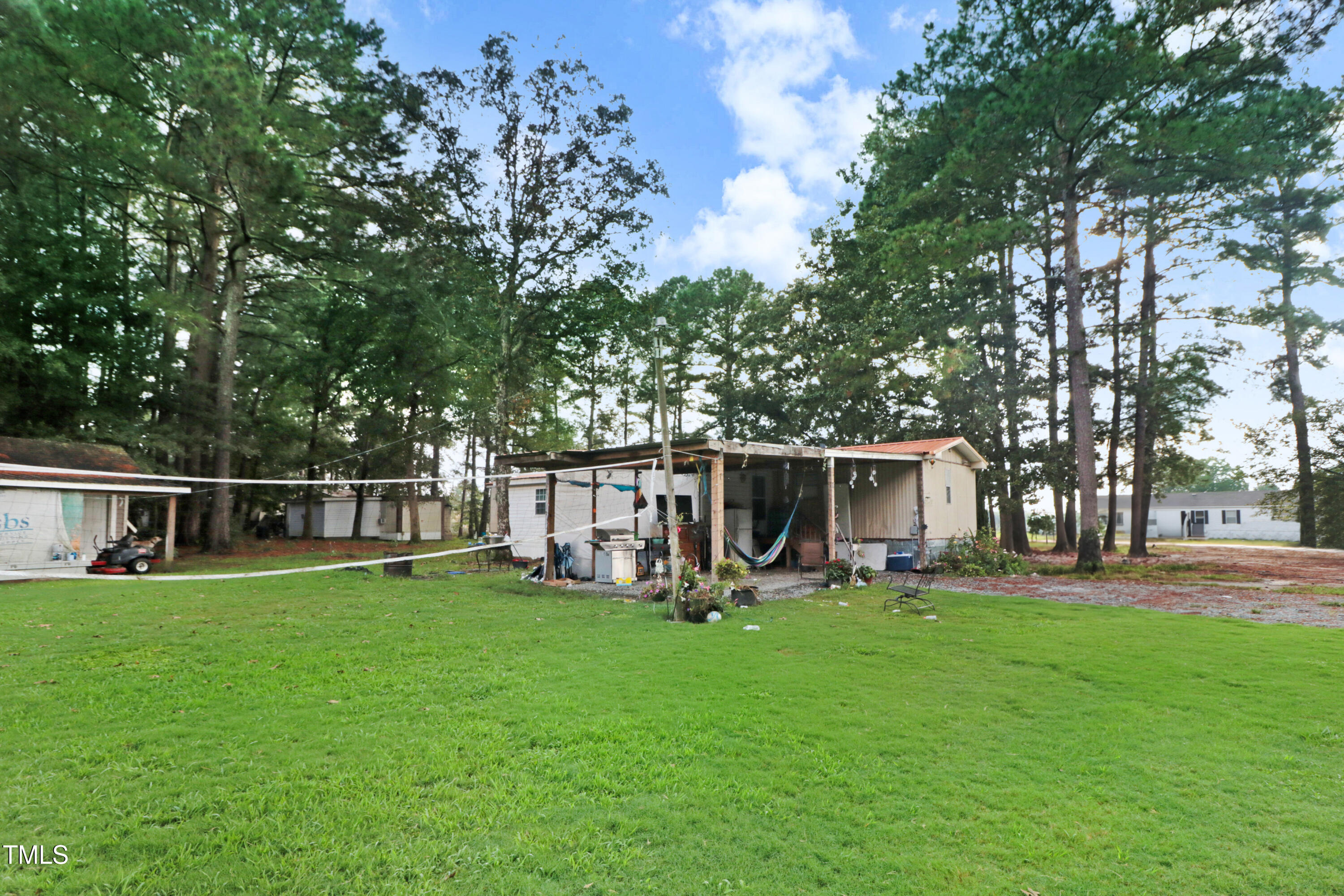 2037 Old Rock Quarry Road Princeton, NC 27569 - Photo 5 of 25 a view of a house with backyard and sitting area