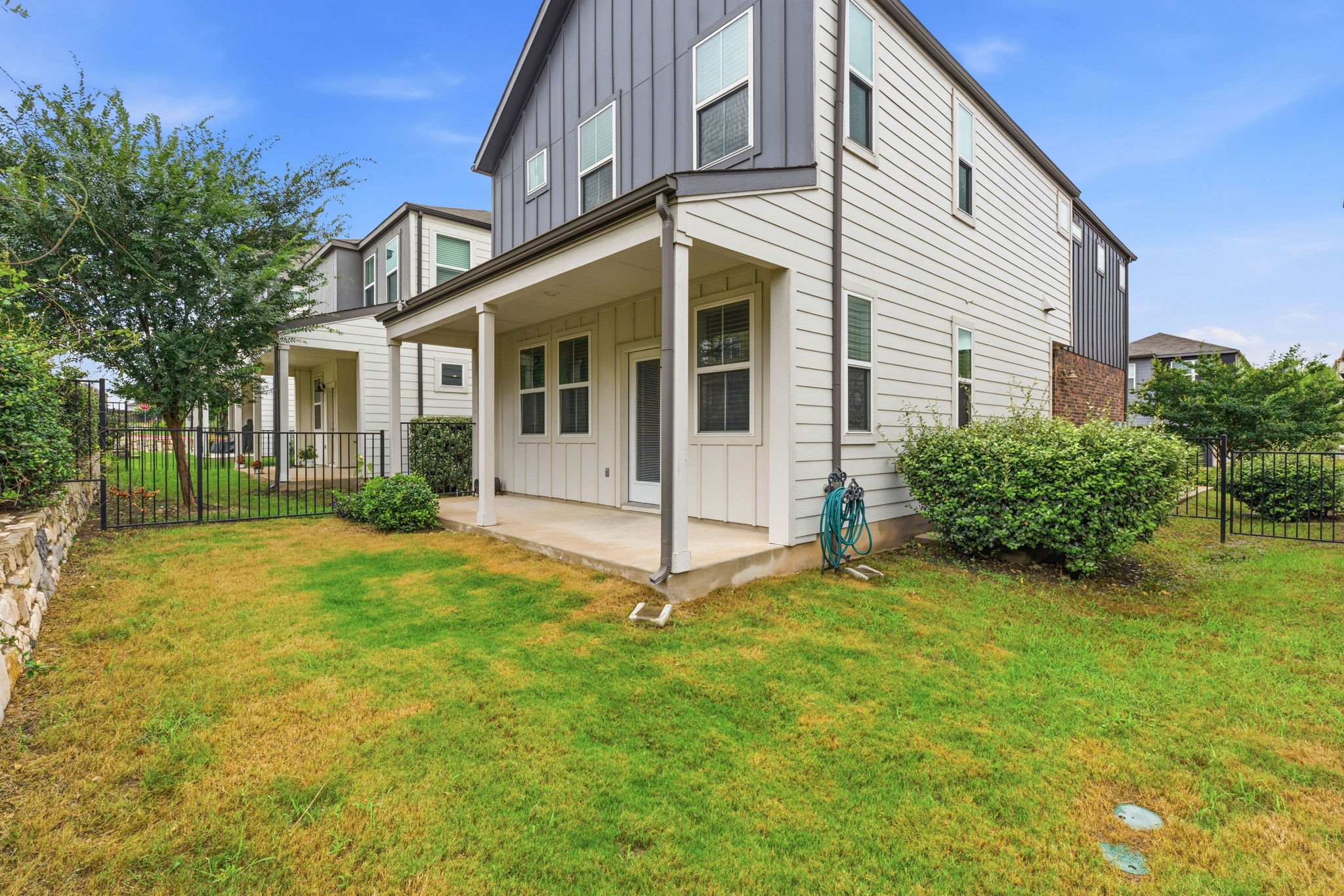 7105 Silver Star Lane, Unit 59 Austin, TX 78744 - Photo 18 of 19 a view of a house with backyard and garden