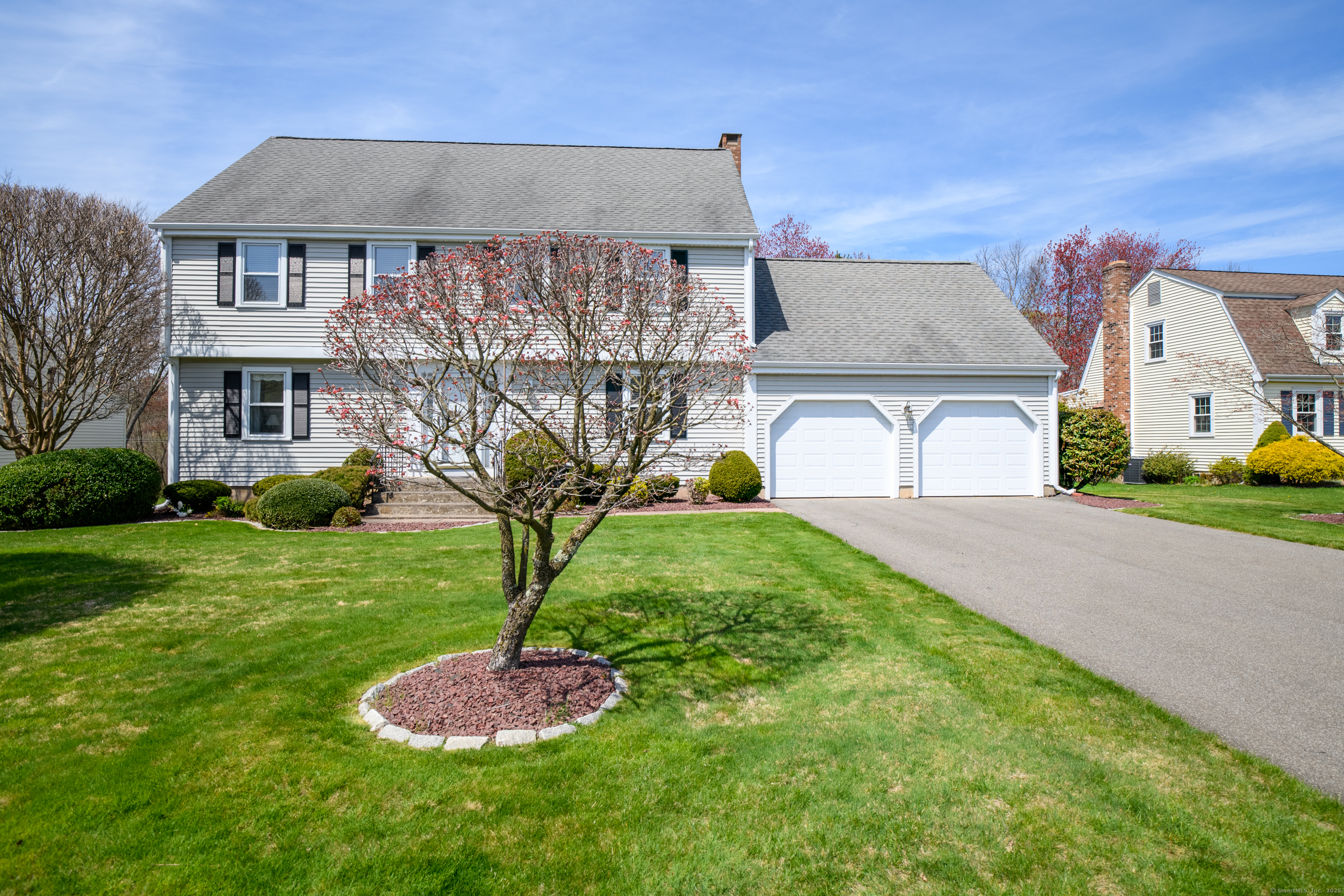 117 Cider Brook Drive Wethersfield, CT 06109 - Photo 1 of 39 a front view of a house with garden
