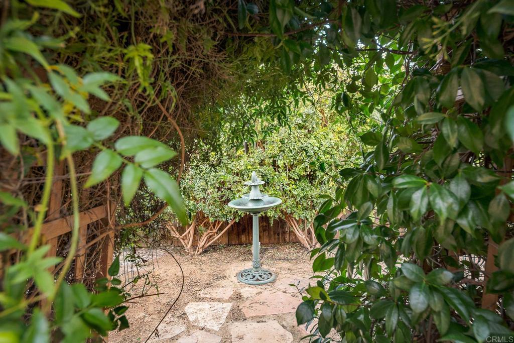 1467 Ronda Place Escondido, CA 92027 - Photo 19 of 26 a backyard of a house with table and chairs